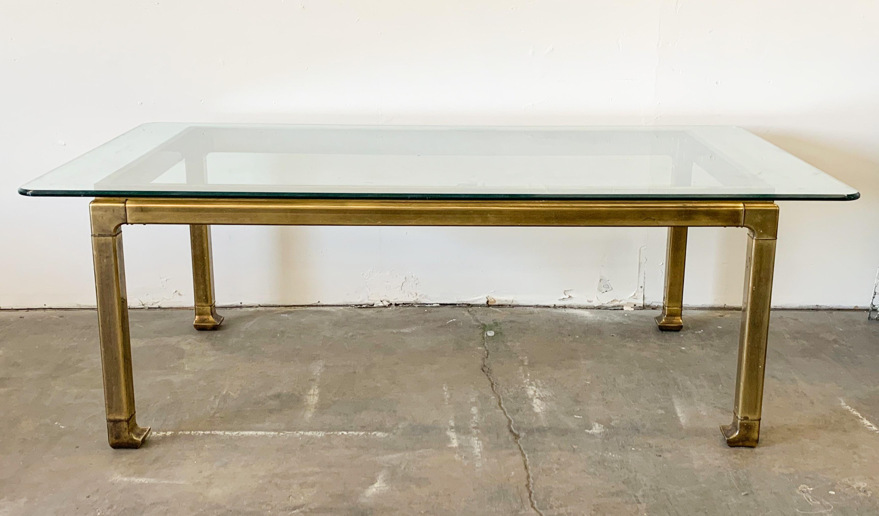 This dining table is simply stunning! This 1970s Hollywood Regency brass dining table designed by Mastercraft features turned in chinoiserie, Ming styled legs and is heavily patinated in a way that only time and great wear can create. Simply put,
