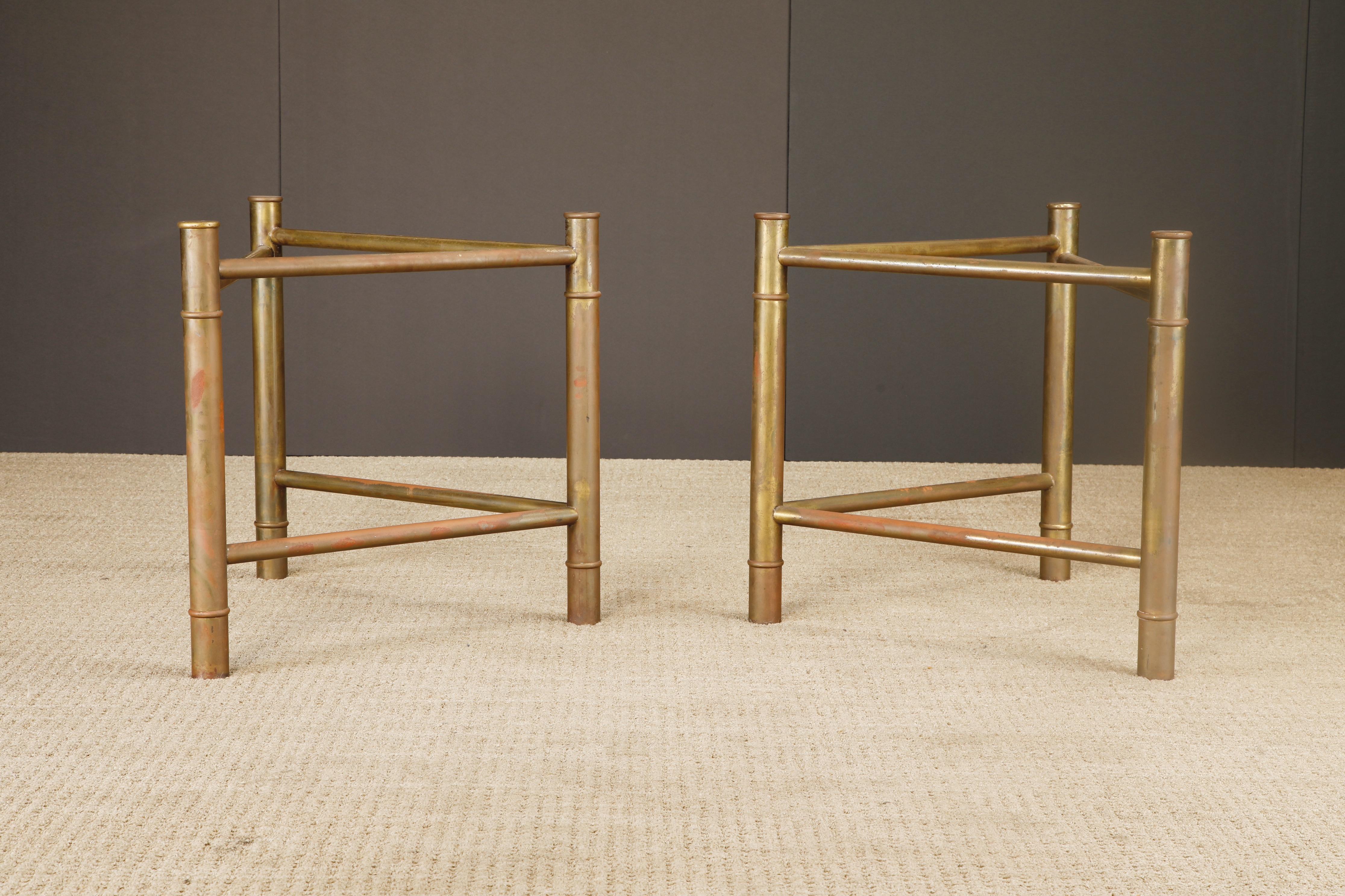 A sculptural pair of Mid-Century Modern table bases by Mastercraft, crafted in brass with a richly aged patina and stylized in a faux bamboo motif. These versatile pedestals exemplify the brand’s signature blend of Hollywood Regency elegance and