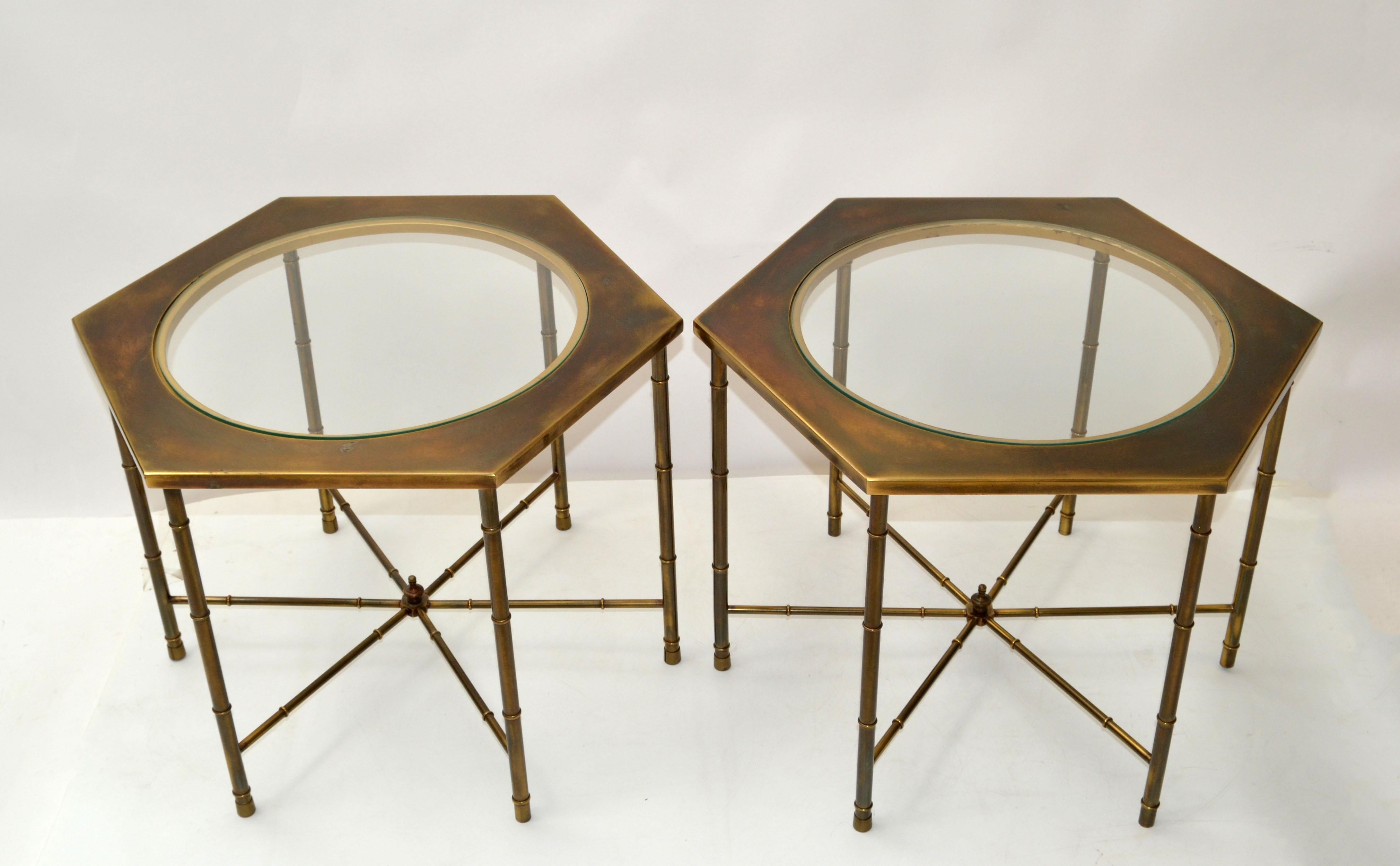 Pair of brass Mastercraft side tables with glass tops in hexagonal shape.
Mid-Century Modern Design with solid Brass Faux Bamboo base, Finial and acid etched Tops.
Round glass measures: 16.38 inches.