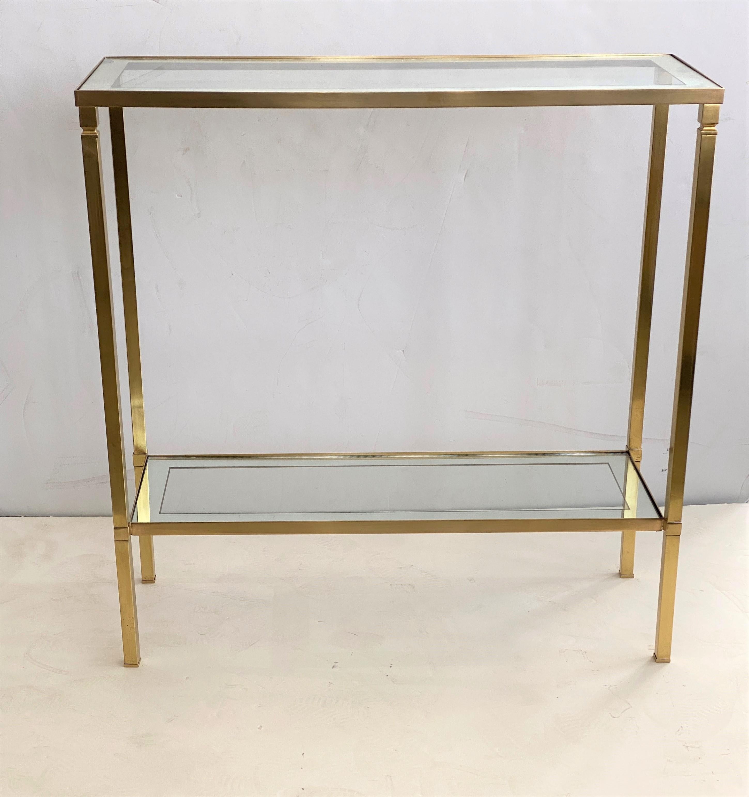 This stylish small scale console is the perfect size for a small area and it is very much in the style of pieces created by Mastercraft. The inset shelves are clear glass with a mirrored band.

Note: There is some loss of mirror on the top shelf