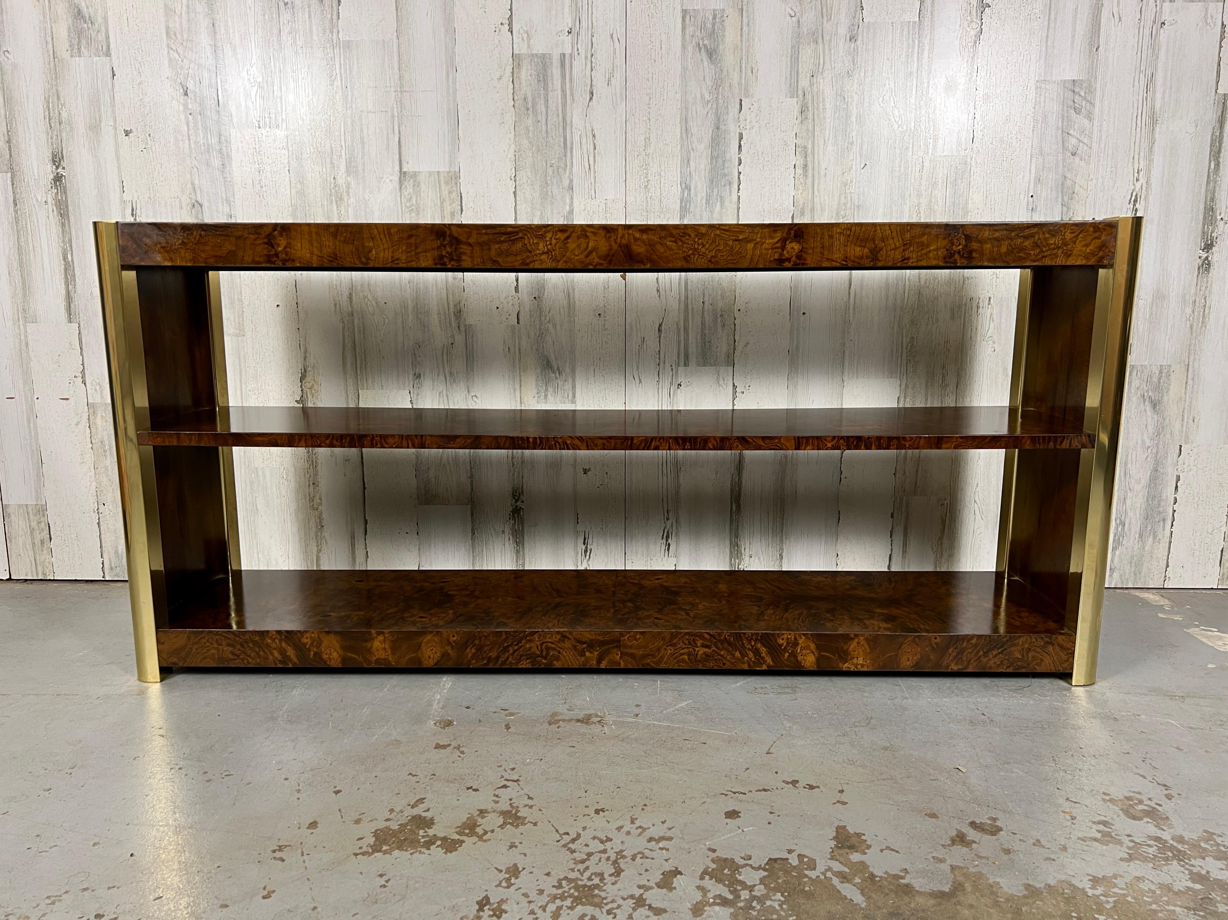 Mastercraft Style Burl & Brass Bookcase. Low profile bookcase that features burl and brass that is finished on both sides. This piece can be easily be floated in a room. 