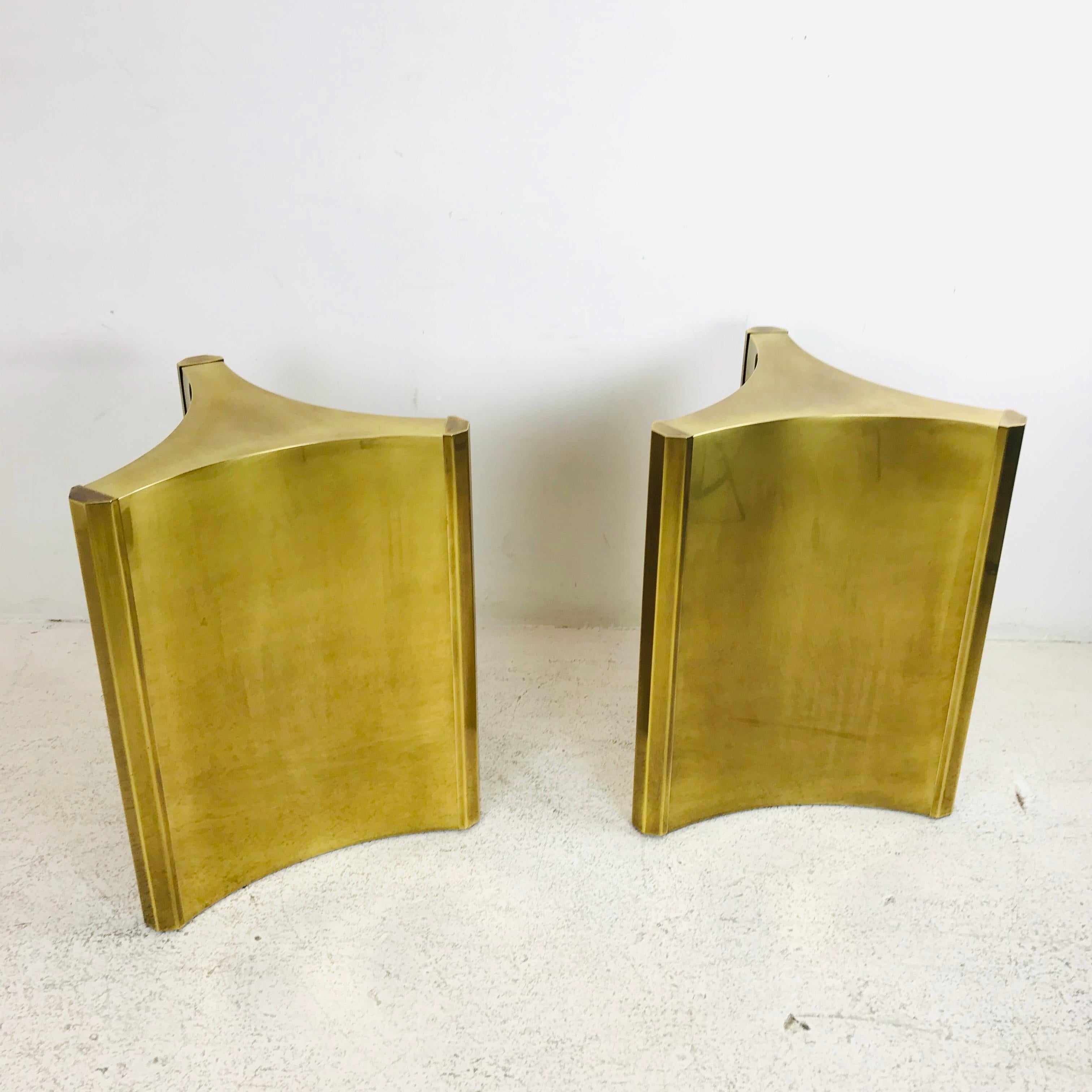 This stunning pair of triangular Hollywood Regency style pedestals are equal parts architectural and sculptural, with a chic yet commanding presence. Made from brass-plated steel In Mastercraft’s signature subtly antiqued finish with protective