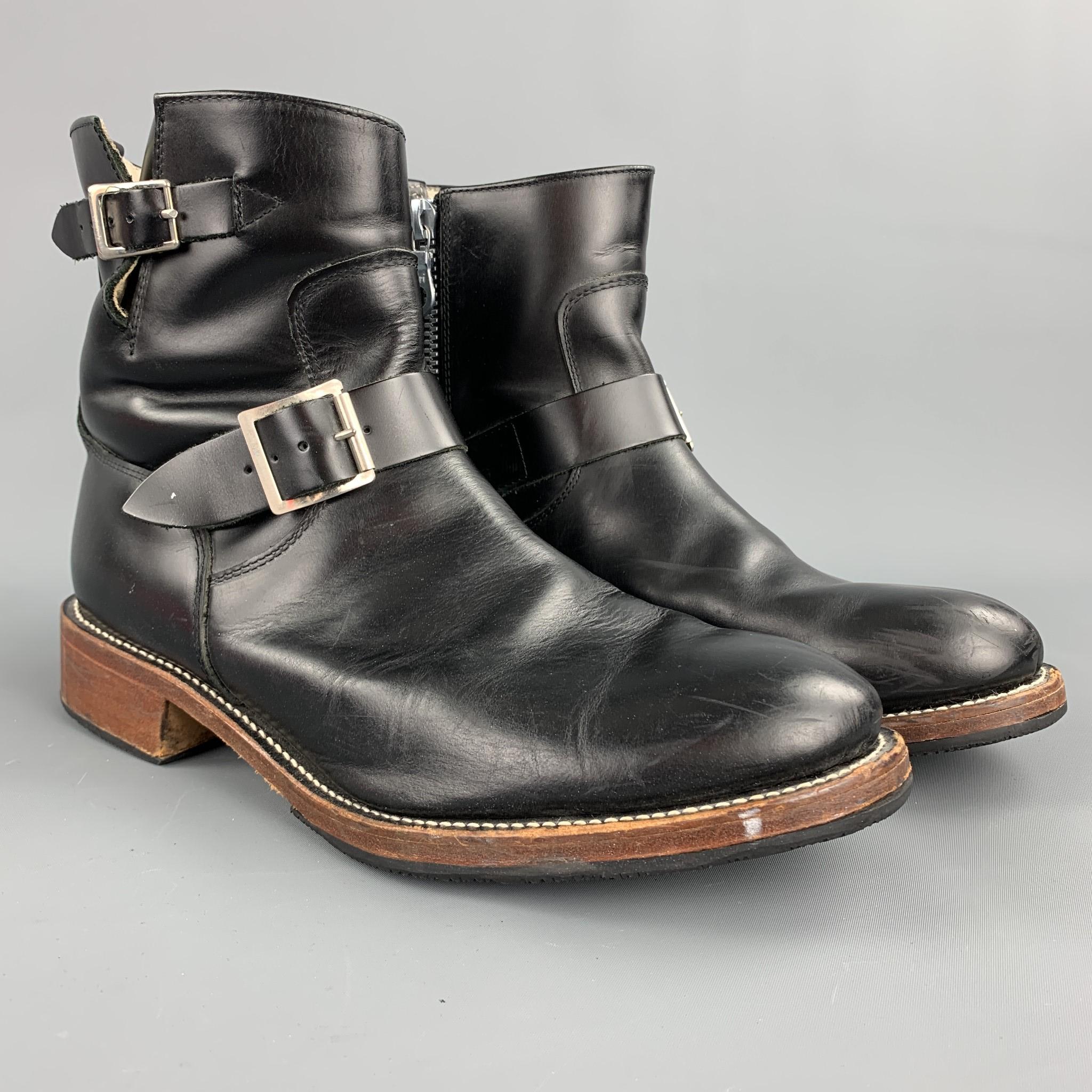 MASTERMIND JAPAN ankle boots comes in a black leather with contrast stitching featuring a belted design, wooden sole, and a side zipper closure. Minor wear.

Good Pre-Owned Condition.
Marked: No size marked

Measurements:

Length: 12 in.
Width: 4.5
