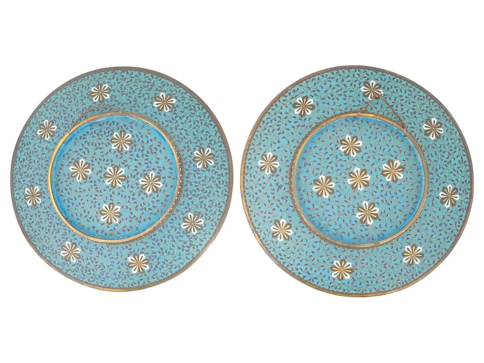 A superb and important pair of Japanese Meiji period cloisonne enamel plates, each executed with remarkable refinement and a level of wire work and color control associated only with the top ateliers of the late nineteenth century. The plates