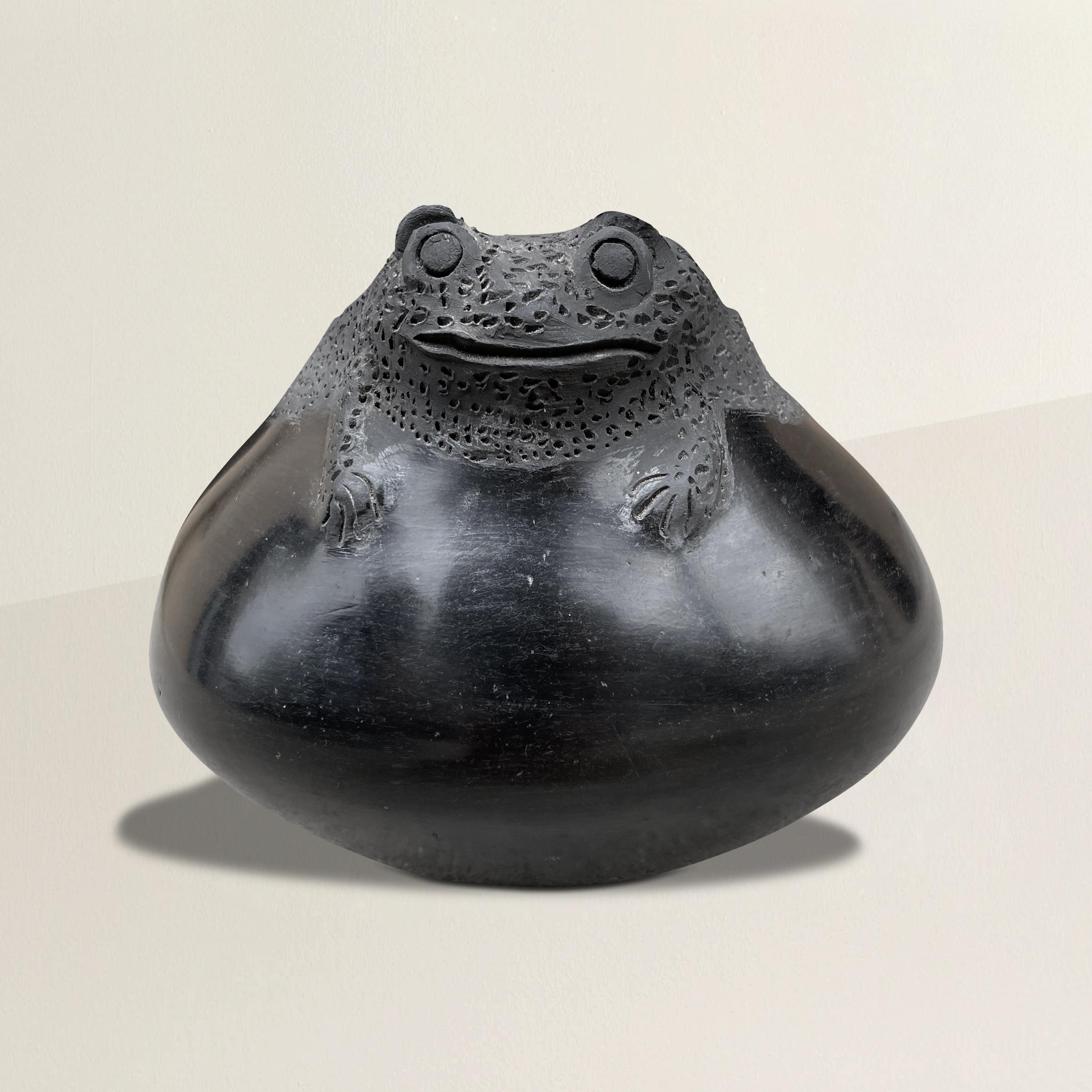 A wonderful and whimsical Mata Ortiz ceramic pot with the most wonderful frog effigy surrounding the lip, and a beautiful burnished finish.
