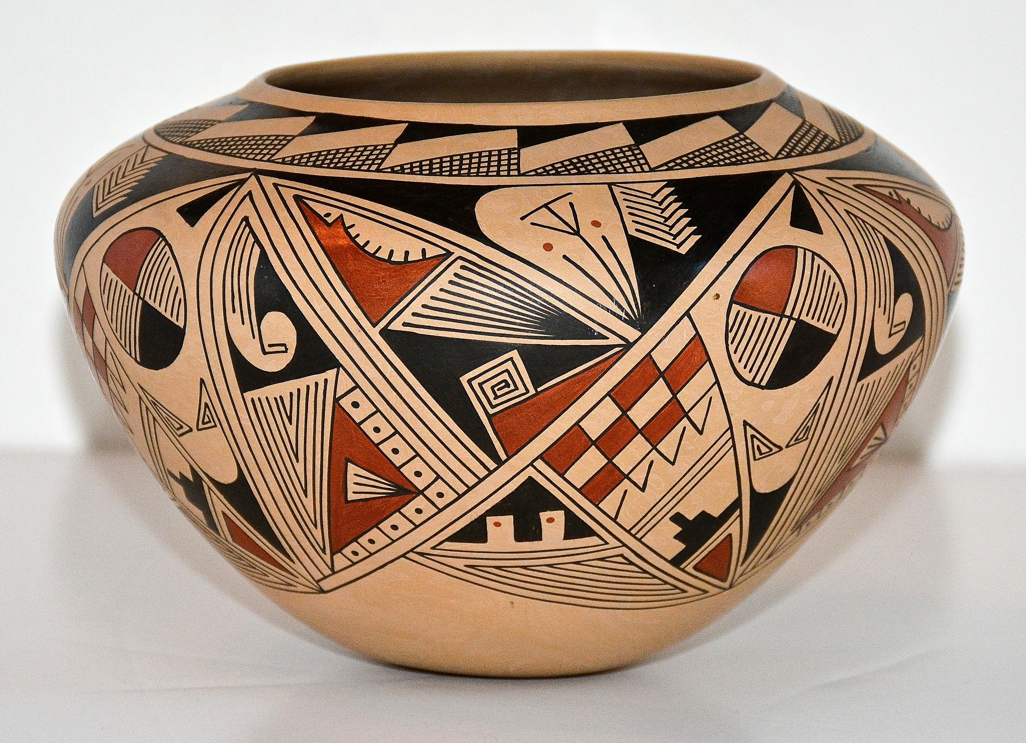 Mata Ortiz polychrome pottery vessel
Ramiro Veloz Sr., Master Potter
1990
Hand-Coiled low fire clay
Pueblo Quezada, Mata Ortiz, Chihuahua, Mexico

An extraordinary ultra thin walled example of hand - coiled Mata Ortiz pottery by Master Potter Ramiro