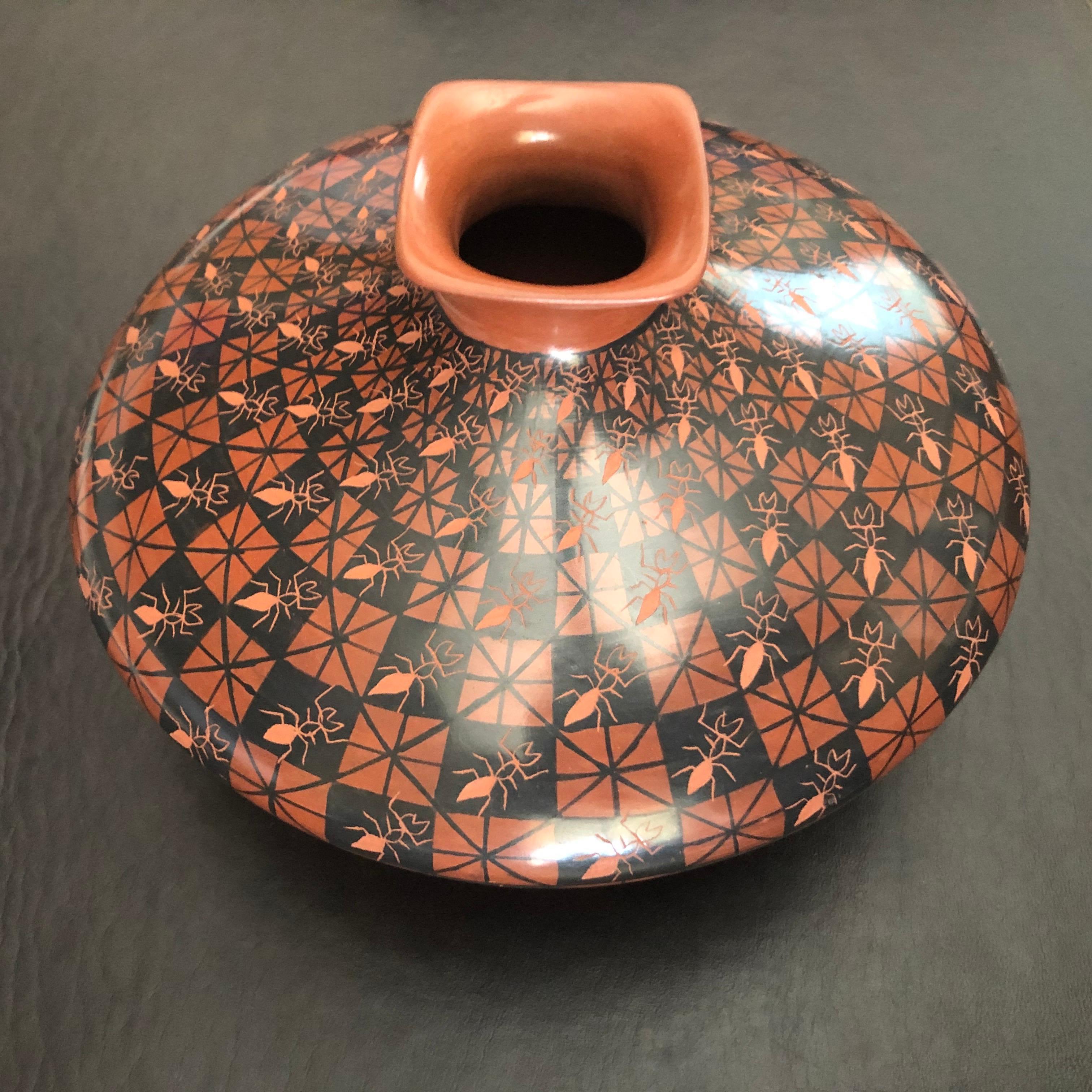 Beautiful hand-turned polychrome Mata Ortiz ant motif vase / seed jar by Yoly Ledezma, circa 1990s. The exquisite piece has wonderful design and color and is exquisitely turned.

Mata Ortiz or Casas Grandes pottery comes from the small village of