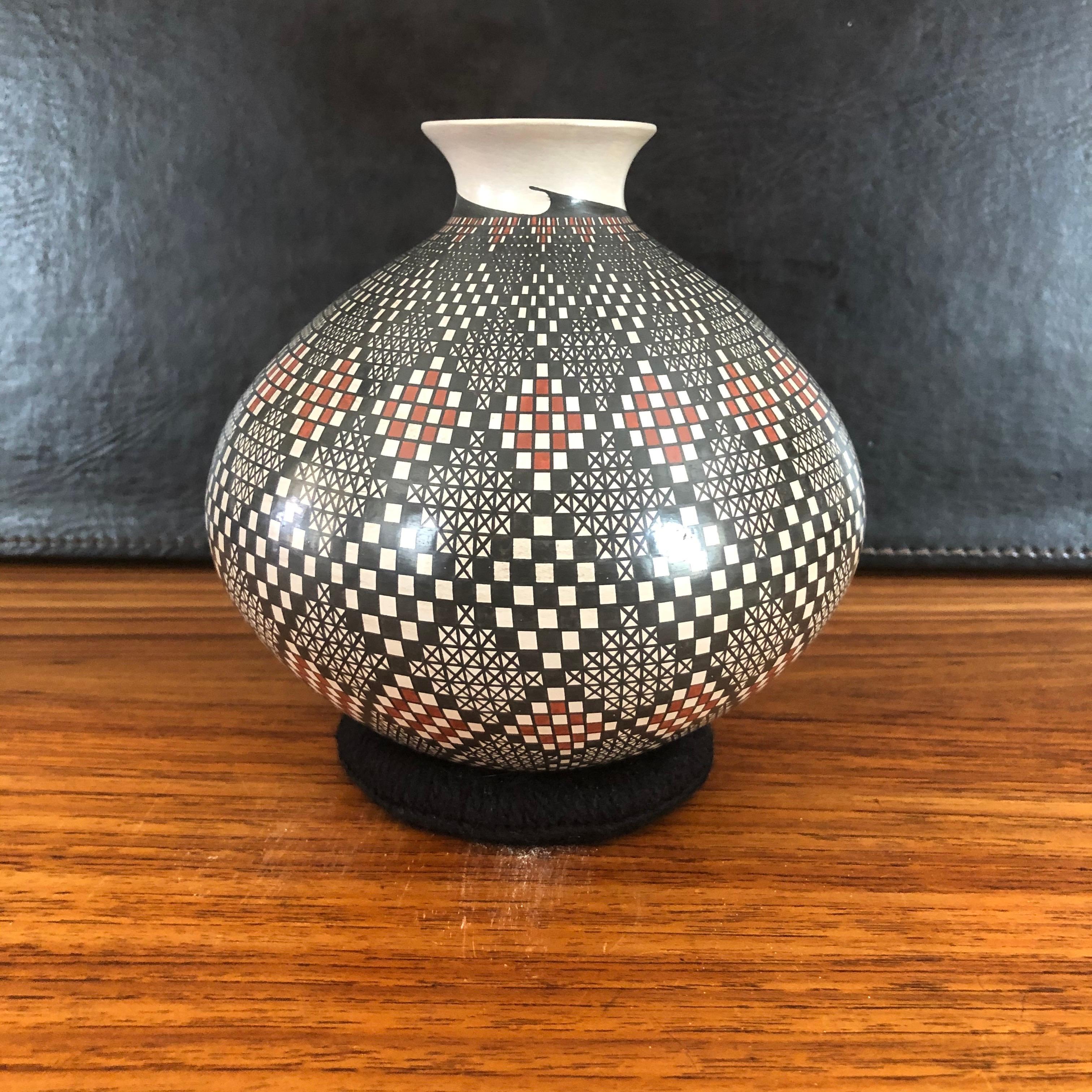 Beautiful hand-turned polychrome Mata Ortiz geometric vase by Blanca Ponce, circa 1990s. The exquisite piece has wonderful design and symmetry. 

Blanca and her husband Humberto, are among the most widely exhibited Mata Ortiz potters. Famous for