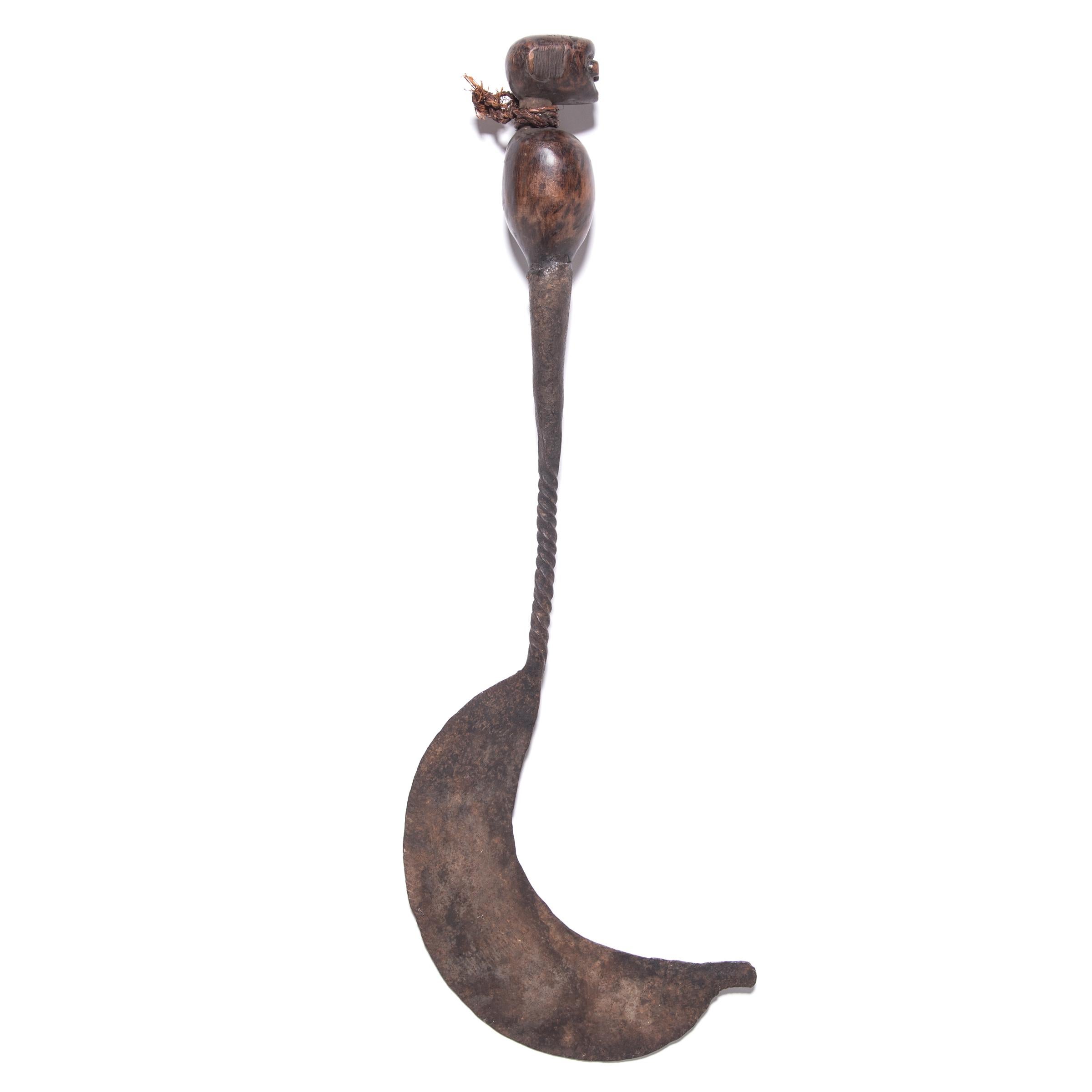 Many pre-coinage African currencies were formed after objects of inherent practical value. This sickle-form iron currency created by an artisan of the Matakam people of Cameroon was shaped after a hand-held sickle to honor the Community's reliance