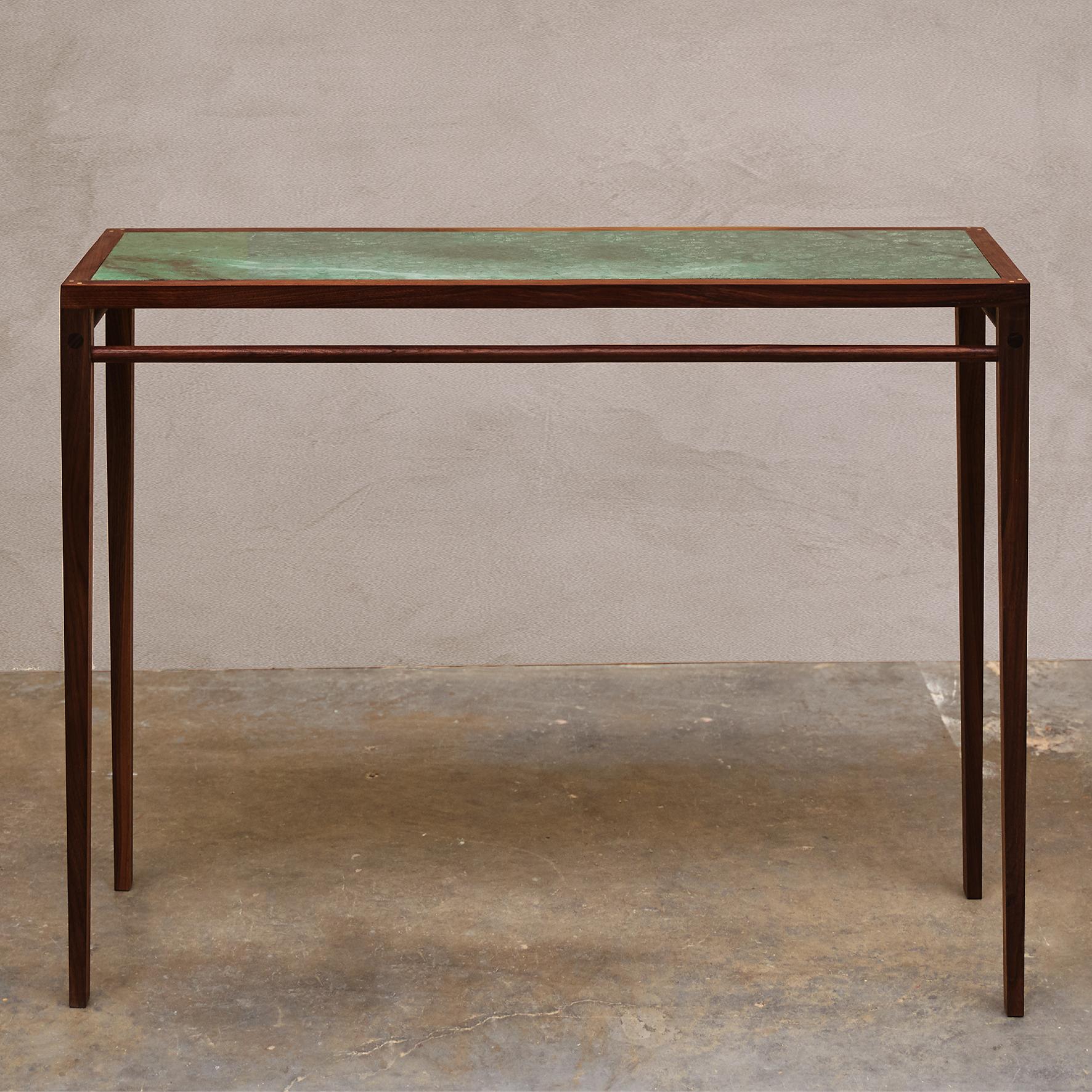 Matang

Ganga console

A walnut and marble table, the rectangular marble top within a walnut frame joined with brass dowels on four square feet.

Contemporary production.
Lead time : 8/9 weeks.

Different marbles and wood can be chosen :
- Pink or