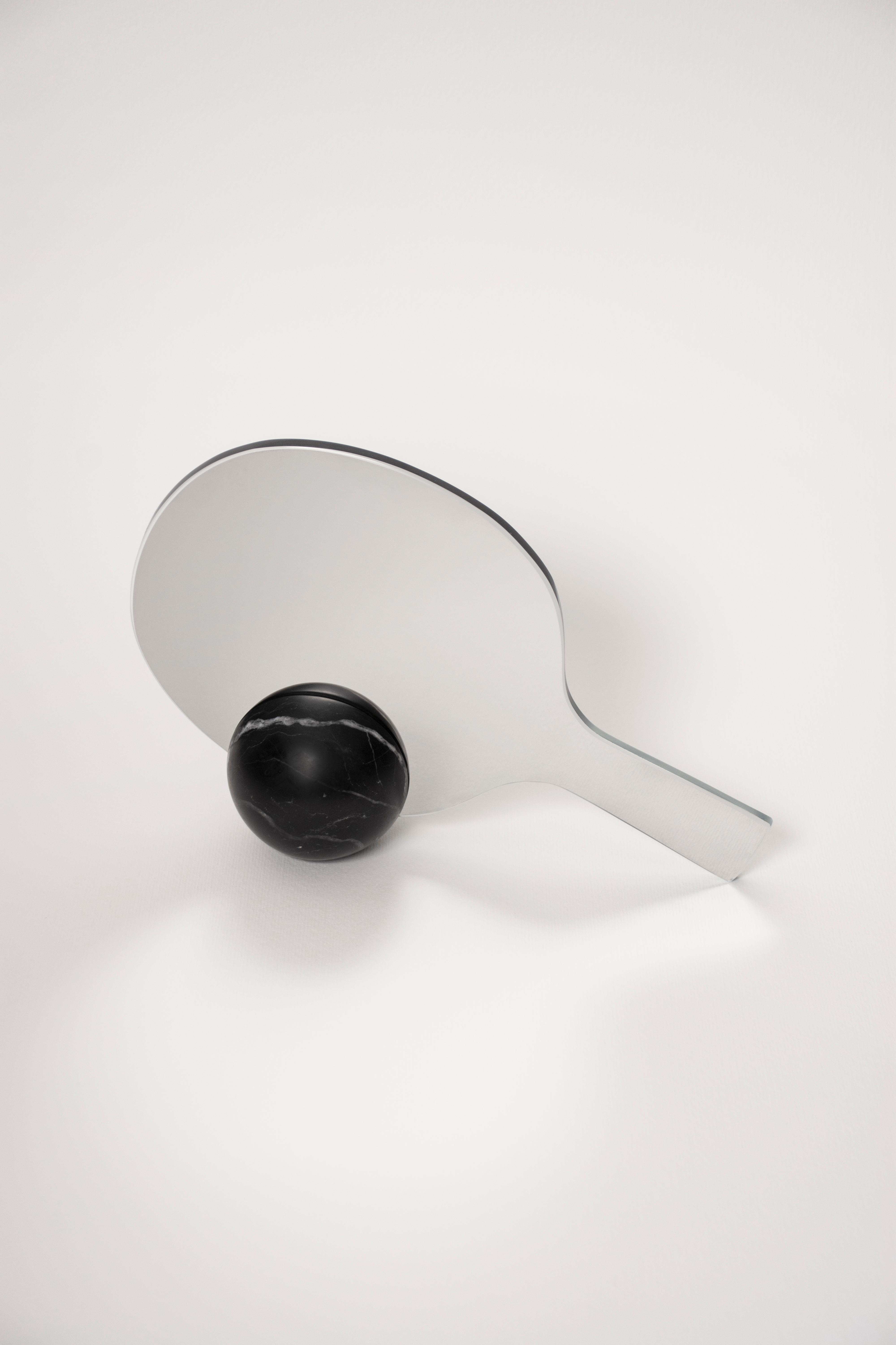 Match table and hand mirror by Studio Lievito
Dimensions: D 27 x W 7 x H 17 cm
Materials: bianco carrara marble/ nero marquina marble, mirror.
Weight: 0.8 kg

An ironic take on the idea of challenging the image reflected back at you in the mirror. A
