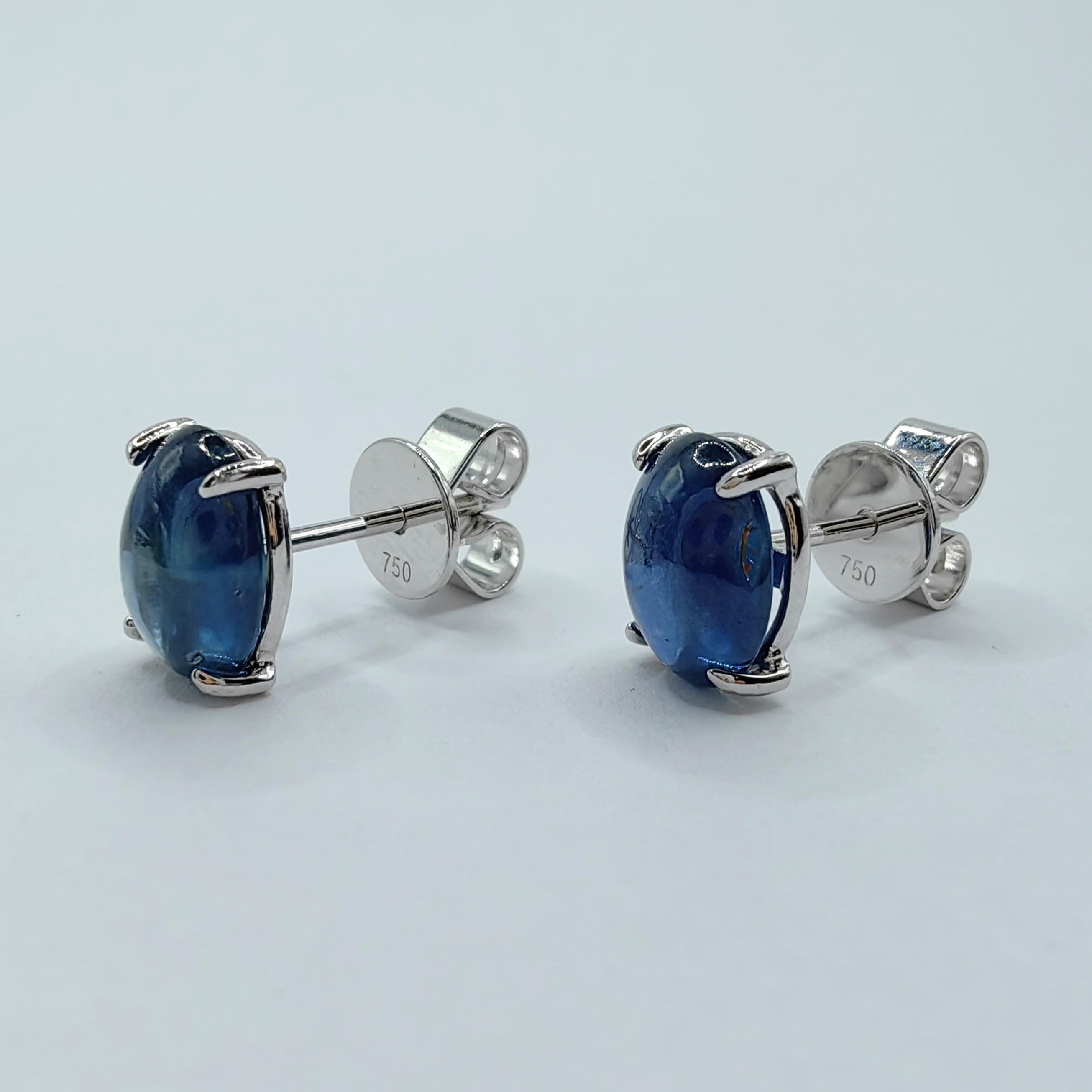 Introducing our stunning Matched 2.95 Carat 8x6mm Cabochon Blue Sapphire Stud Earrings, where the timeless beauty of blue sapphires and the elegance of 18K white gold harmonize to create a truly remarkable piece.

These earrings feature two