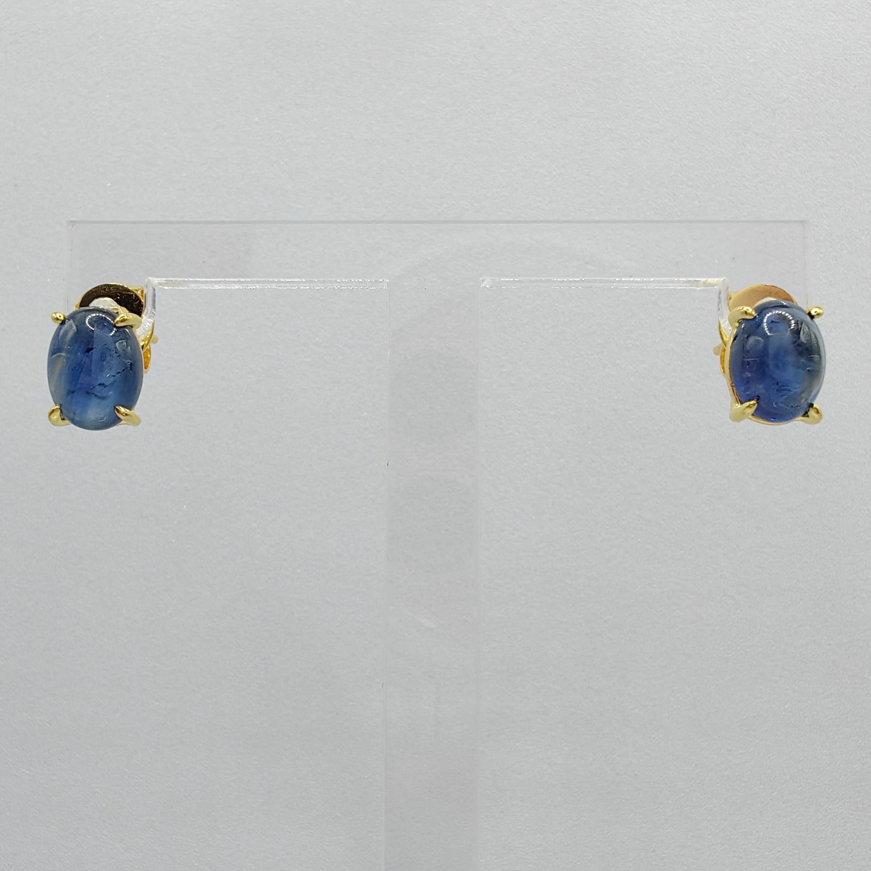 Introducing our stunning Matched 3.86 Carat 8x6mm Cabochon Blue Sapphire Stud Earrings, where the timeless beauty of blue sapphires and the elegance of 18K yellow gold harmonize to create a truly remarkable piece.

These earrings feature two