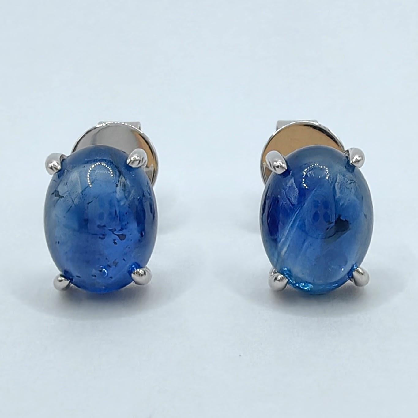 Introducing our stunning Matched 4.24 Carat 8x6mm Cabochon Blue Sapphire Stud Earrings, where the timeless beauty of blue sapphires and the elegance of 18K white gold harmonize to create a truly remarkable piece.

These earrings feature two