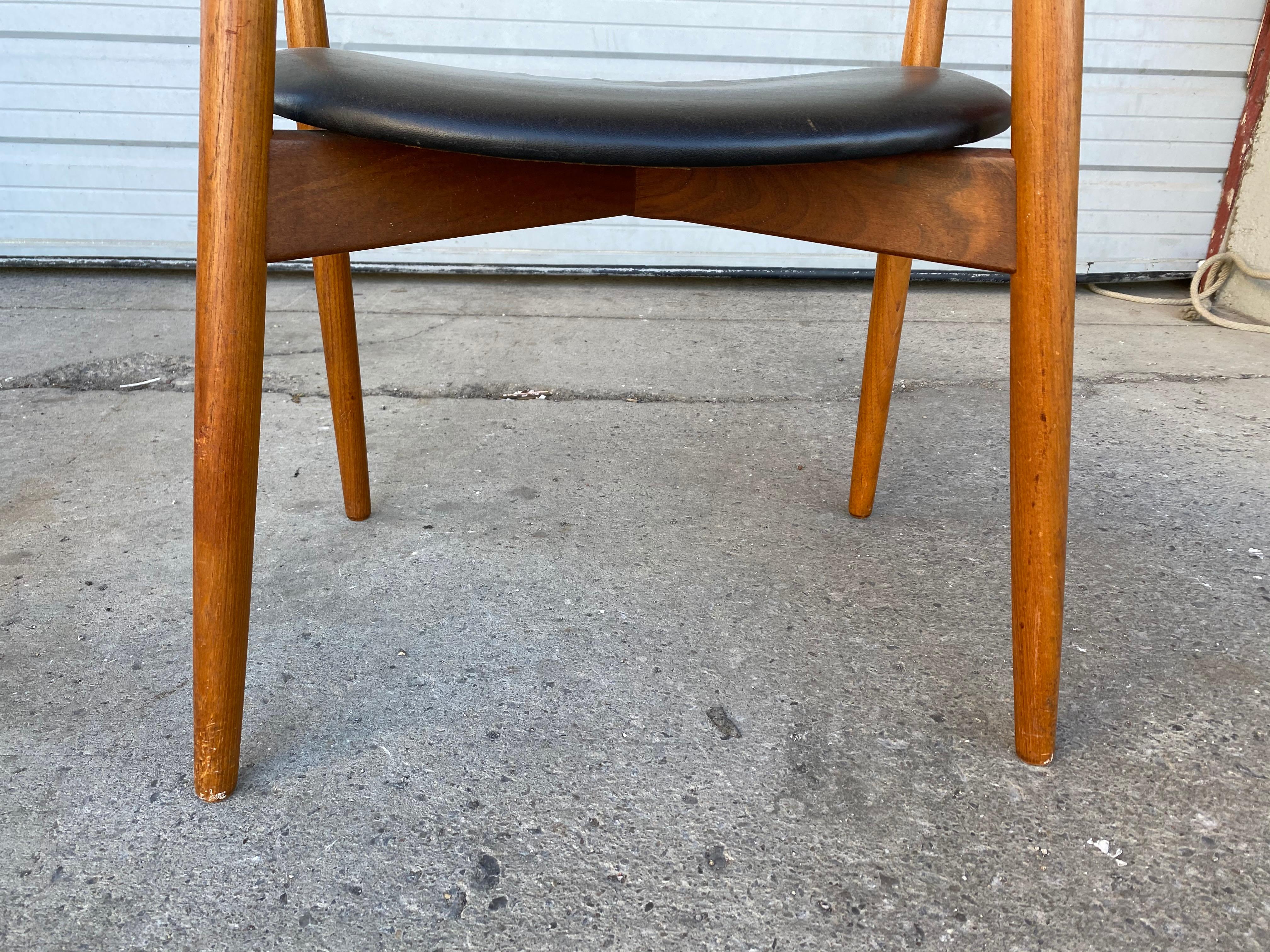 Solid teak frames, seat leather upholstered, model 59. Designed in 1960 by Harry Ostergaard for Randers Møbelfabrik. Superior quality and construction, extremely comfortable, amazing design. Stamped under seats.
