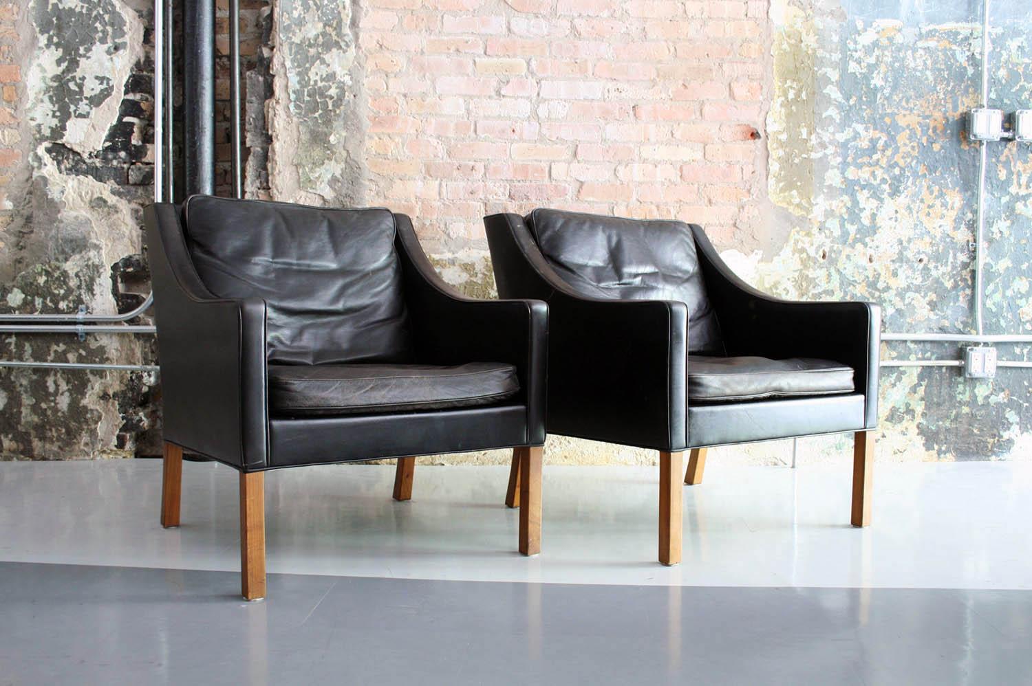 Beautiful pair in vintage original condition. Down filled leather cushions. Danish craftsmanship and modern lines.