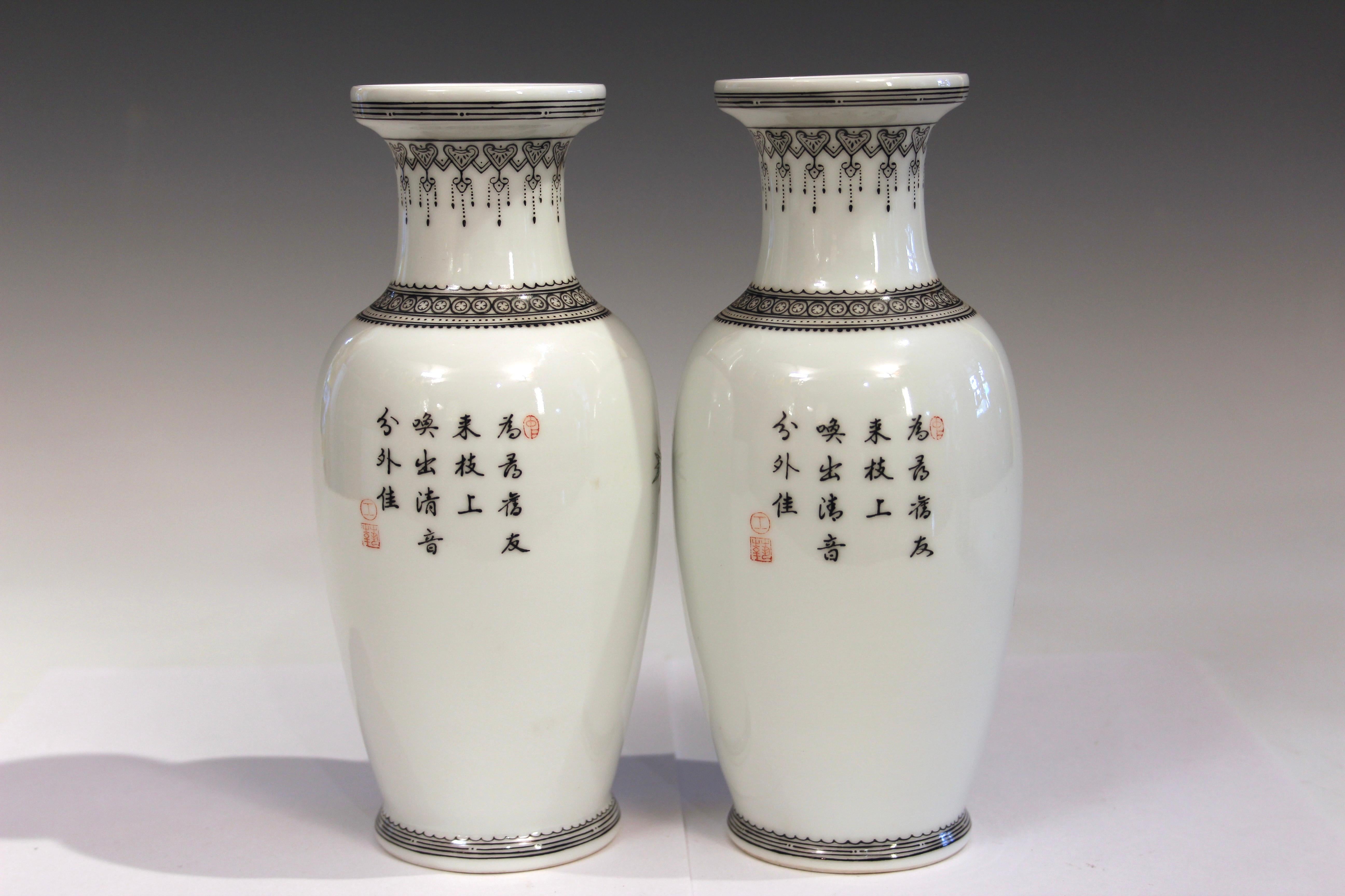 Matched pair Chinese export porcelain famille rose vases, circa late 20th century. Hand turned with nice quality painting. Decorated with birds amongst blossoms on front, poems on reverse. Four character Jingdezhen Zhi marks on base. Original paper