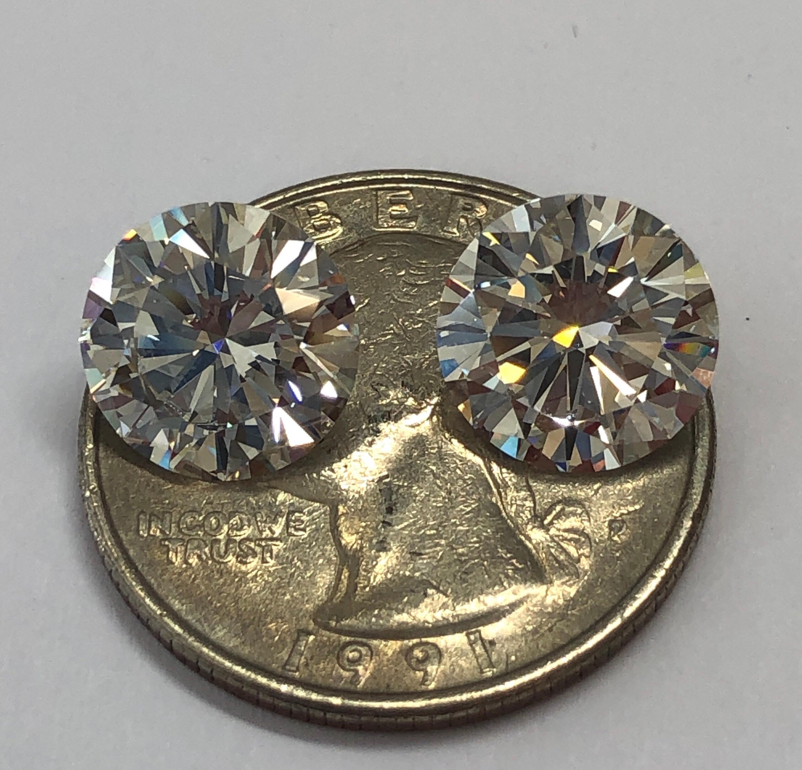 The matched pair of D / IF diamonds (D Color Internally Flawless) weighs 8.13 carat total. It is extremely difficult to find a match in this size and quality. The diamonds are triple Excellent Cut, Polish and Symmetry, No Fluorescence and