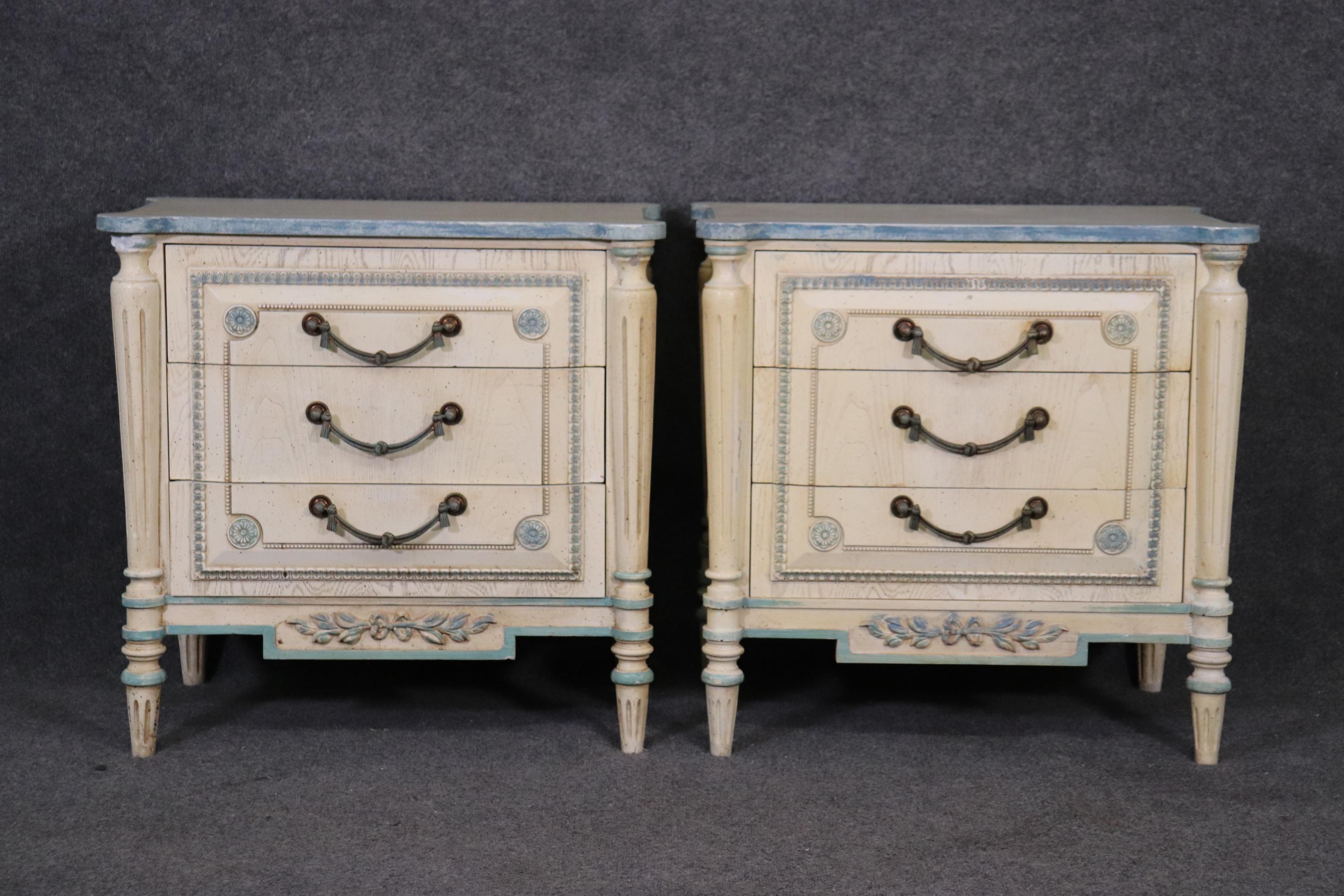 This is a beautiful pair of white and blue French stye nightstands. They are designed in the Directoire style and have classic lines and design. They measure 27 wide x 26 tall x 16 deep. They date to the 1960s era.