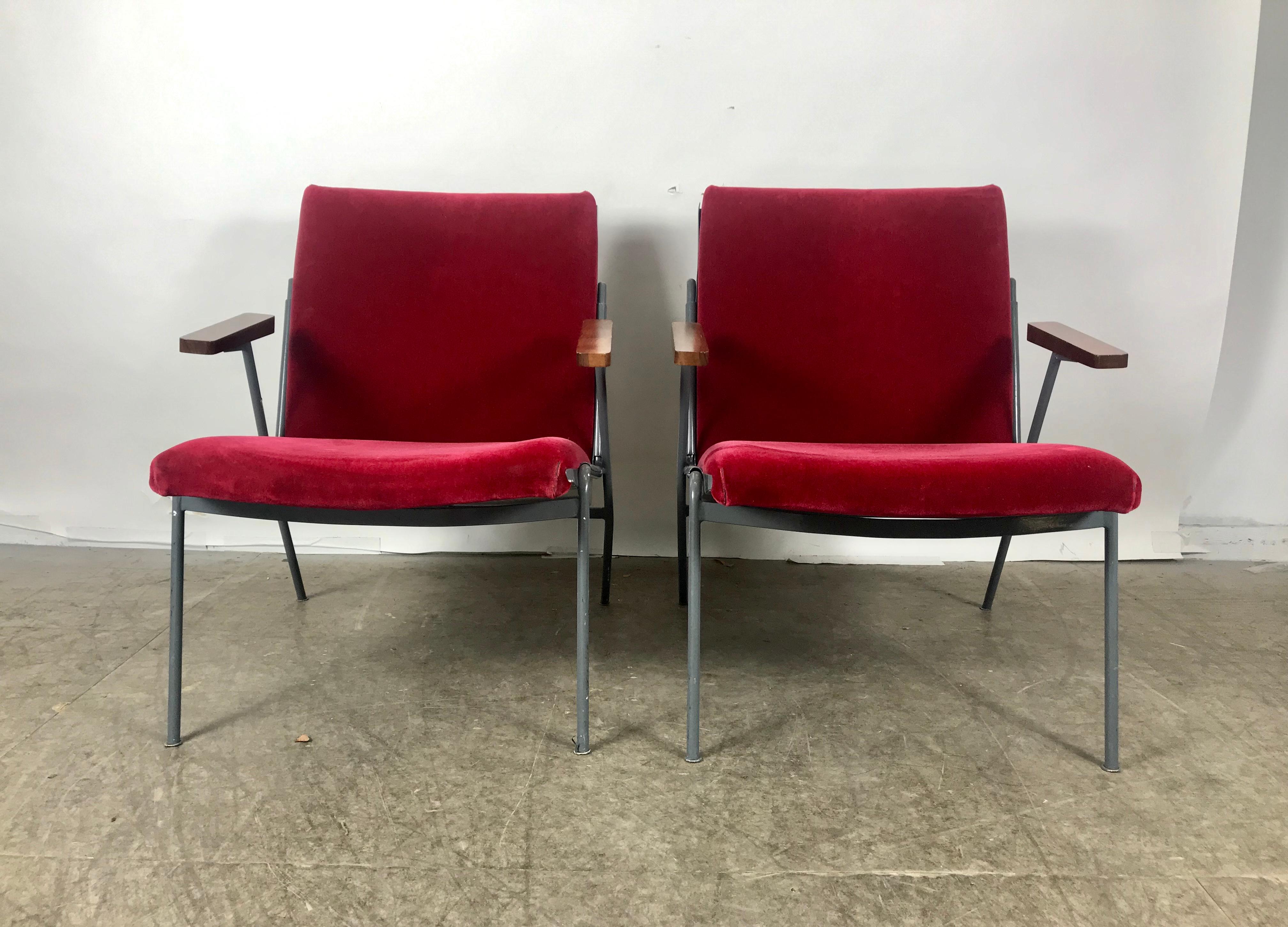 Elegance meets industrial. Pair of lounge chairs, metal frames, walnut arm rests and stunning red mohair seat and back. Extremely comfortable, superior quality and construction, amazing style and design, imported from France, appear to be made in