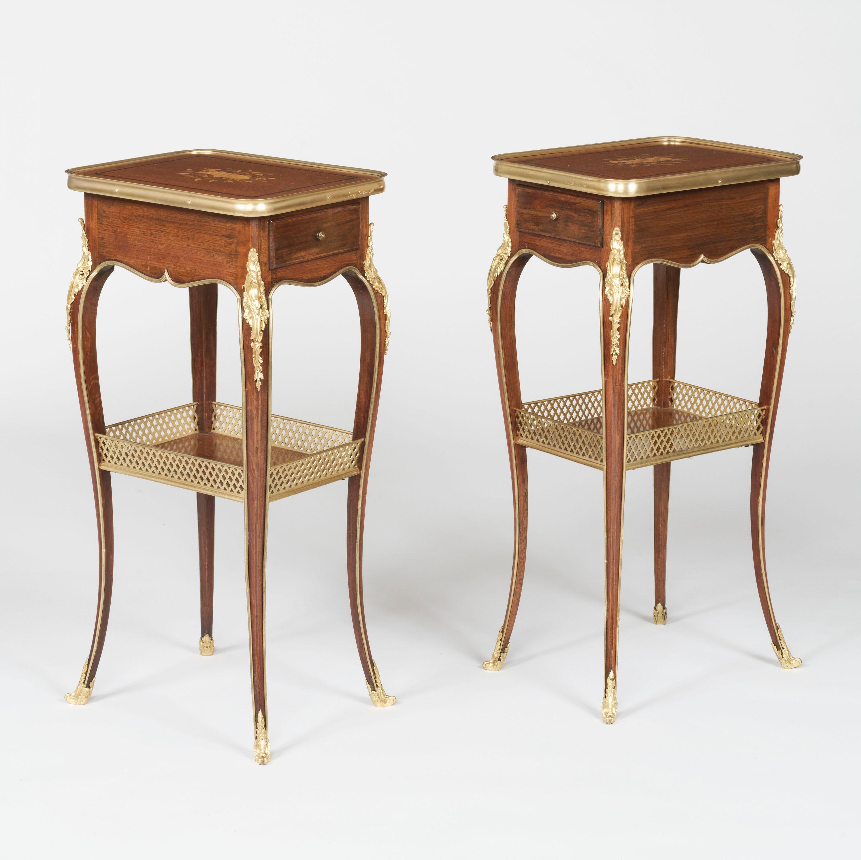 A Matched Pair of Tables Ambulantes
in the Transitional Style
By Henry Dasson

Constructed from mahogany and ormolu-mounted throughout, the tables supported on cabriole legs with bronze sabots and acanthus-styled espagnolettes, a galleried undertier