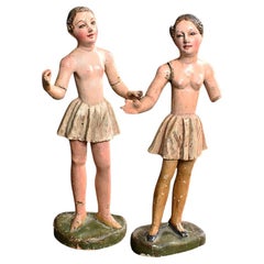 Paire de figurines angéliques en pin sculpté à la main du 19e siècle  