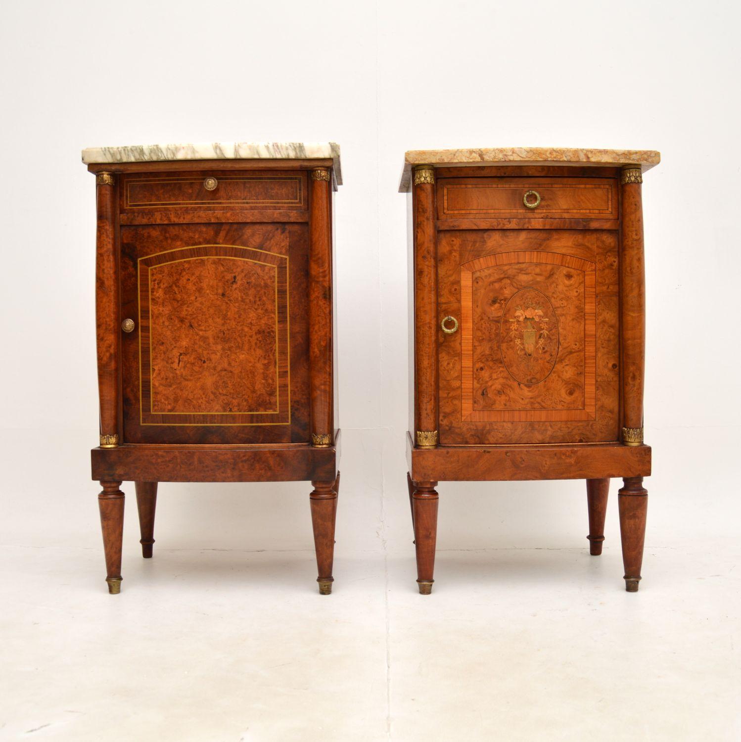 A stunning matched pair of antique French marble top bedside cabinets, dating from around the 1890-1900 period.

They are of superb quality, predominantly burr walnut which has gorgeous grain patterns and colour tones, the doors also have amazing