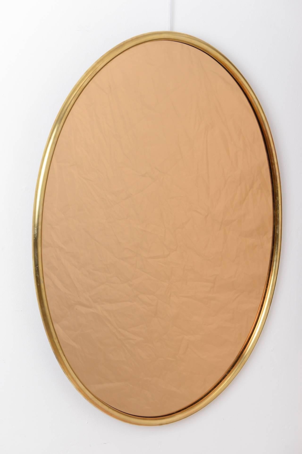Oval brass framed bronzed mirrors, circa 1970.







 