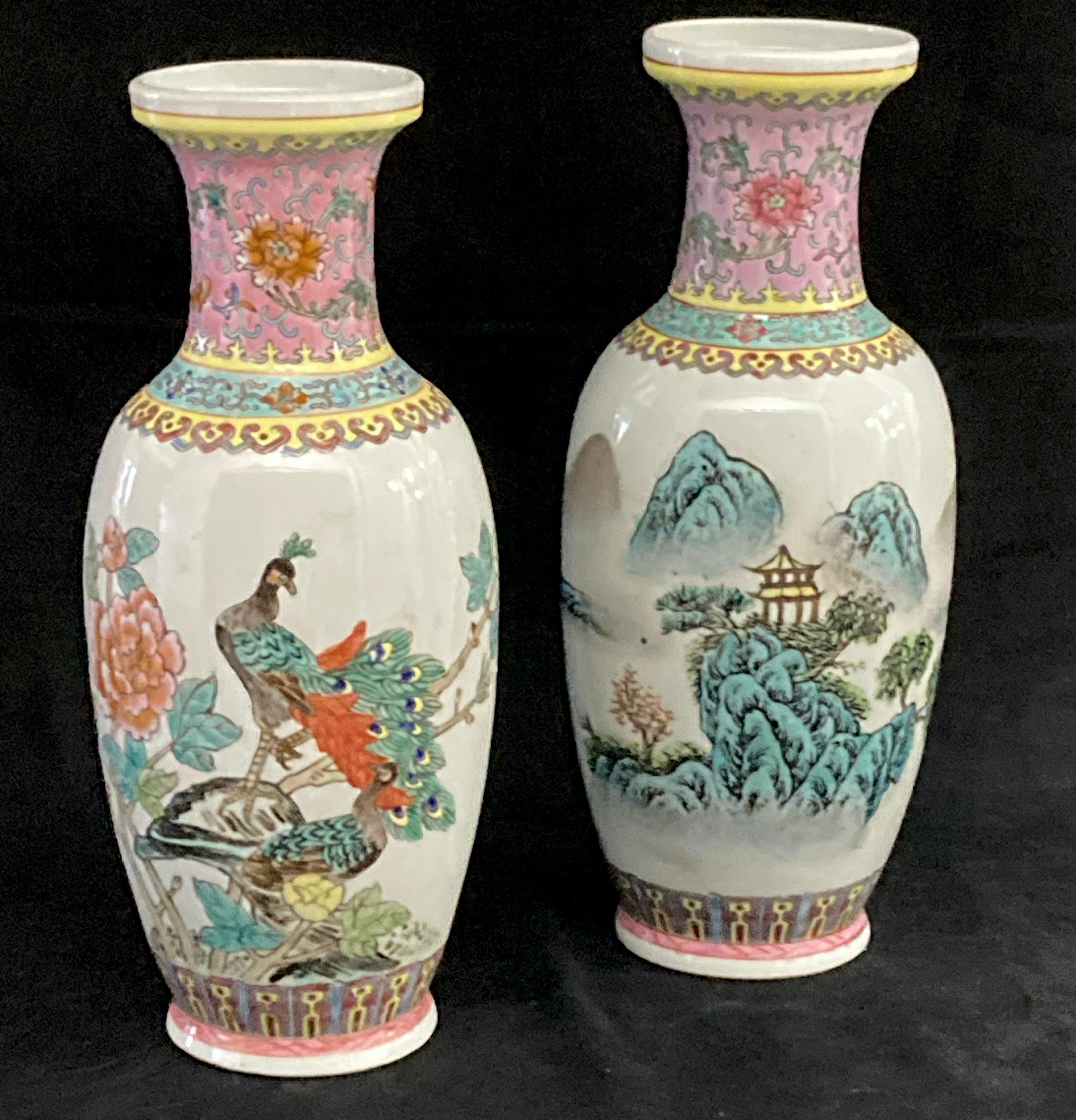 A matched pair of Chinese Famille Rose Jingdezhen vases. One with enamelled decoration in pink and green, depicting a peacock on rockery and peony branch.
The other in the same palette depicting a mountain landscape, possibly near