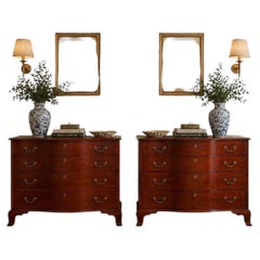Matched Pair of Georgian Mahogany Serpentine Chests, One Signed Joseph Rawson of