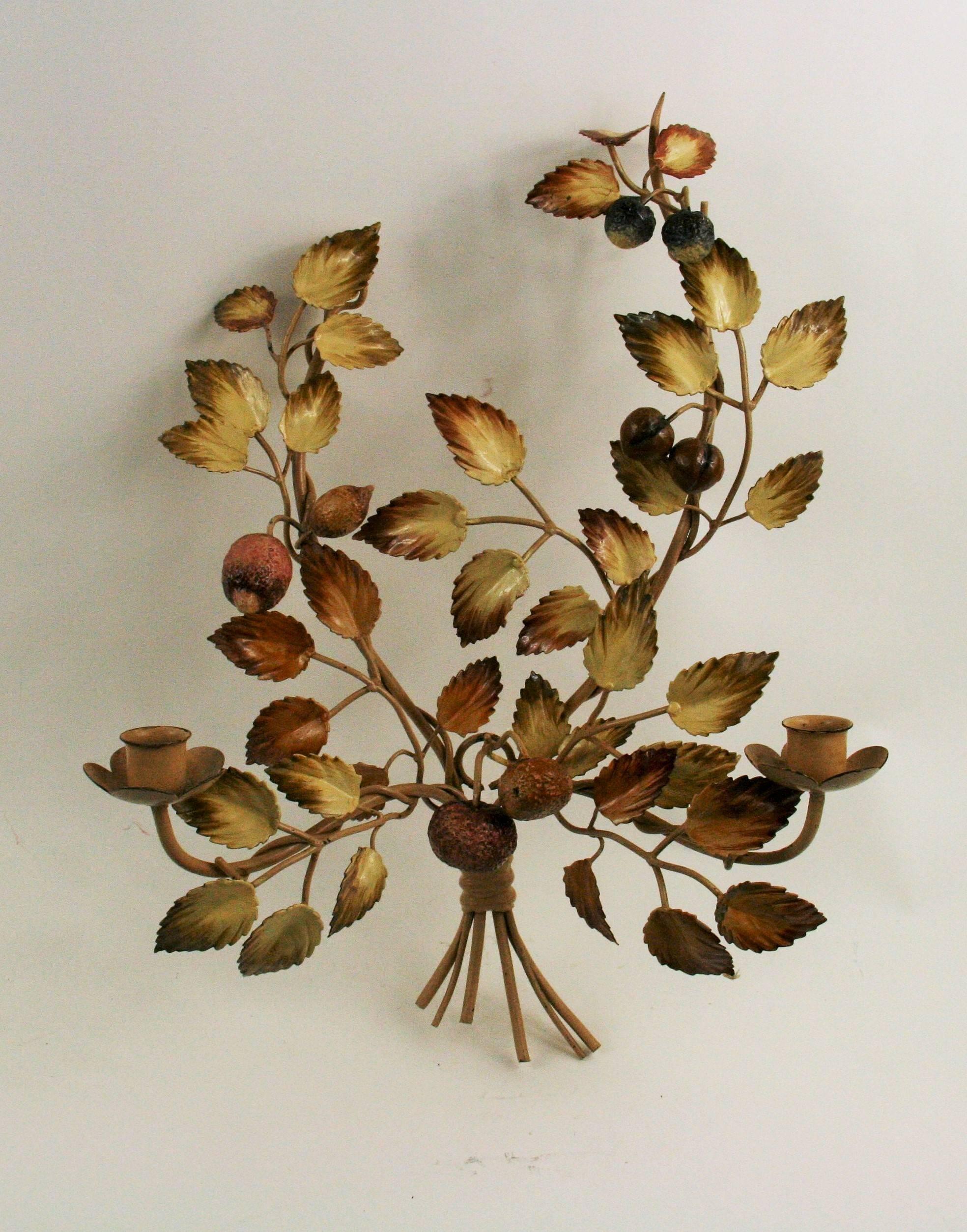 2-4026 a pair of circa 1940s Italian tole double arm candle sconces.
Adorned with leaves and acorns.