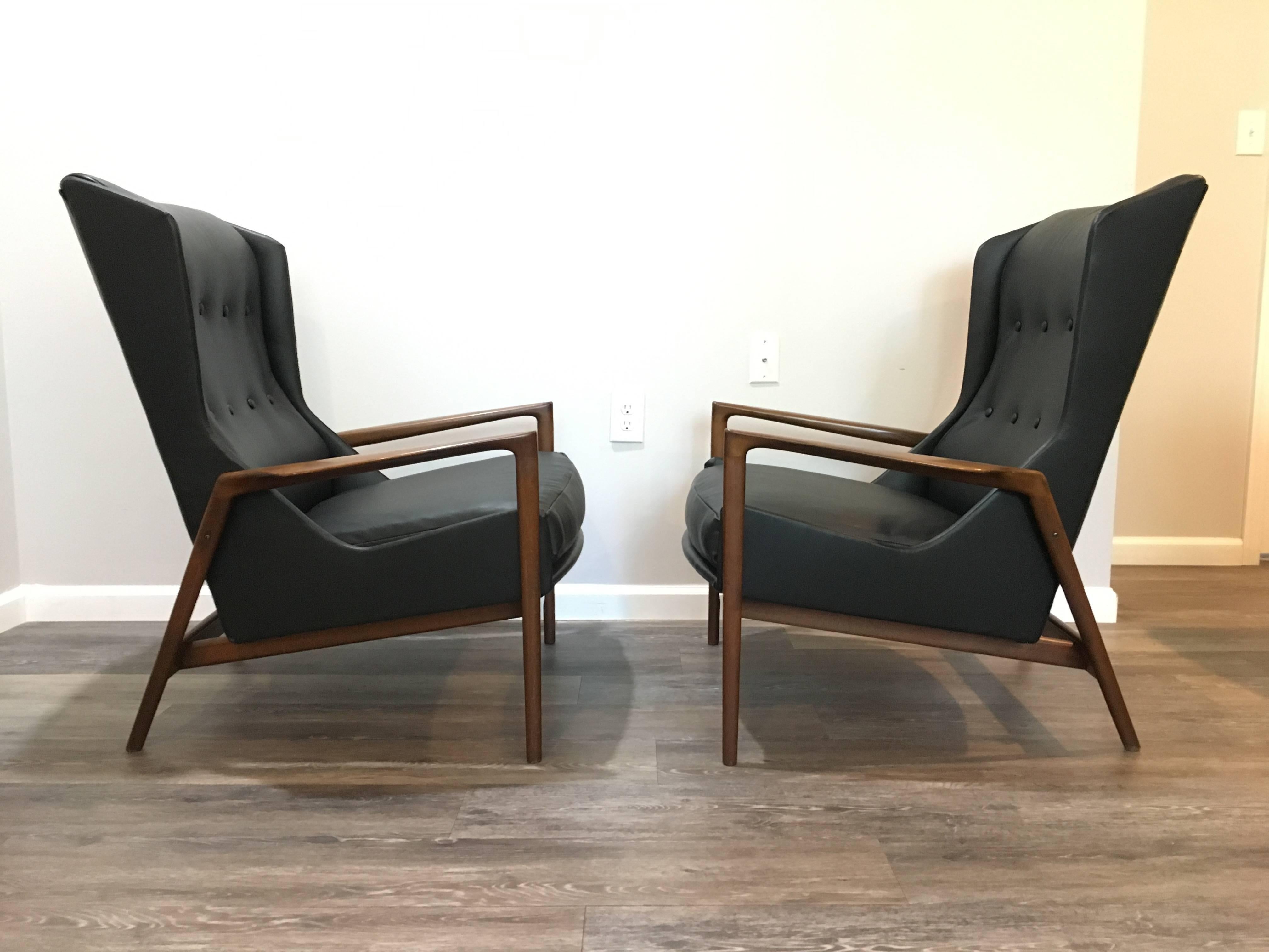 A handsome pair of IB Kofod Larsen wingback Lounge chairs done up in supple Moore & Giles leather having new strap suspension and cushioning throughout. 

Measures: Chairs 38 x 33 x 32