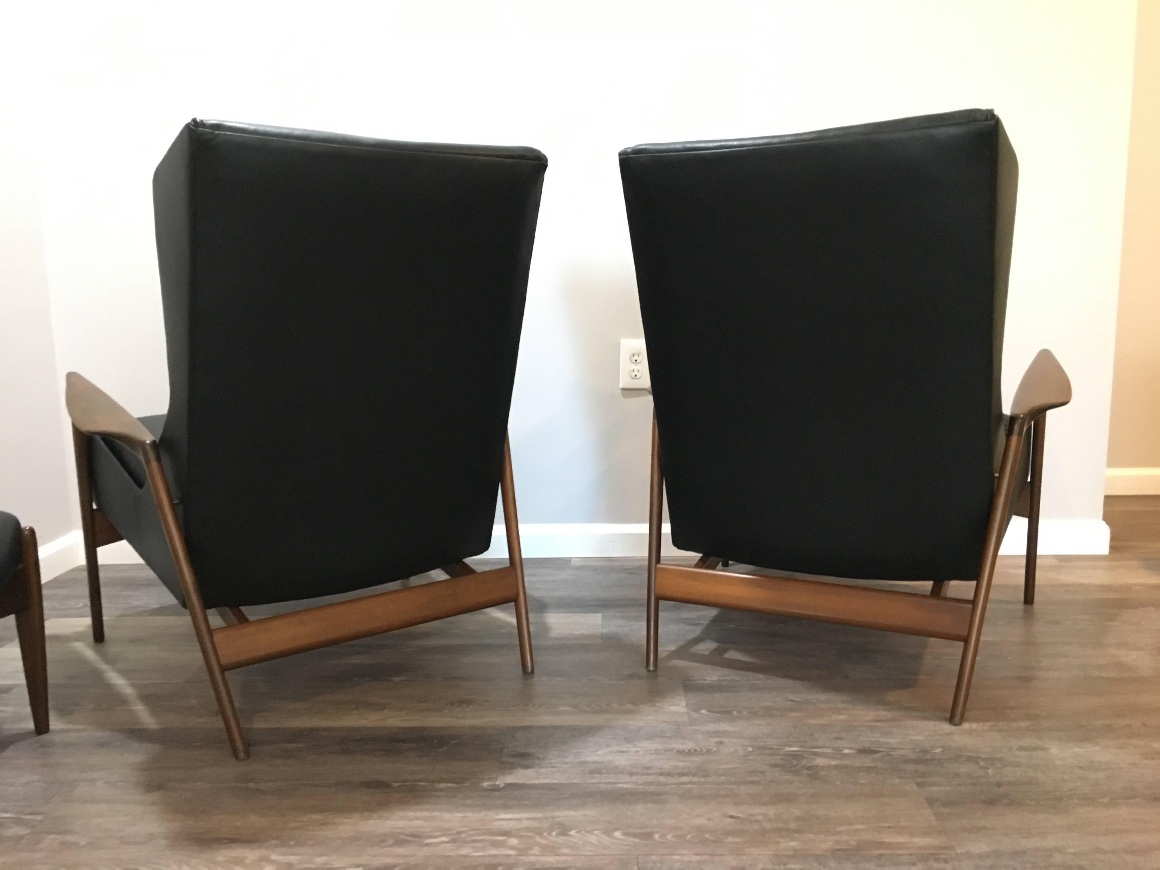 Scandinavian Modern Matched Pair of Kofod Larsen Leather Wingback Chairs and Ottoman