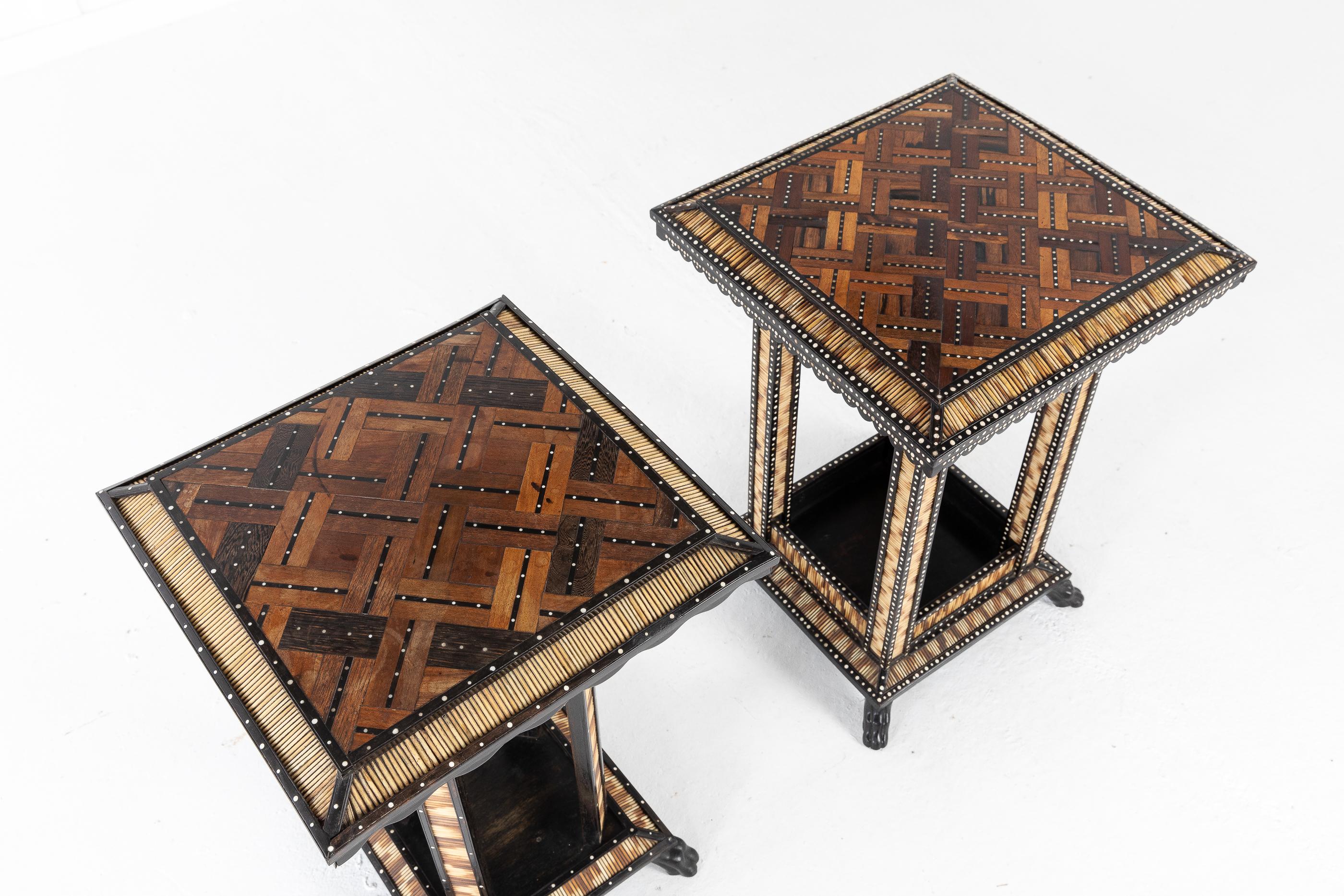 19th century, matched pair of Ceylonese, ebony and ebonized, bone inlaid occasional tables with porcupine quills. Inlaid specimen wood tops.

These tables were fully restored in our workshops, replacing all the missing quills and bone using quill