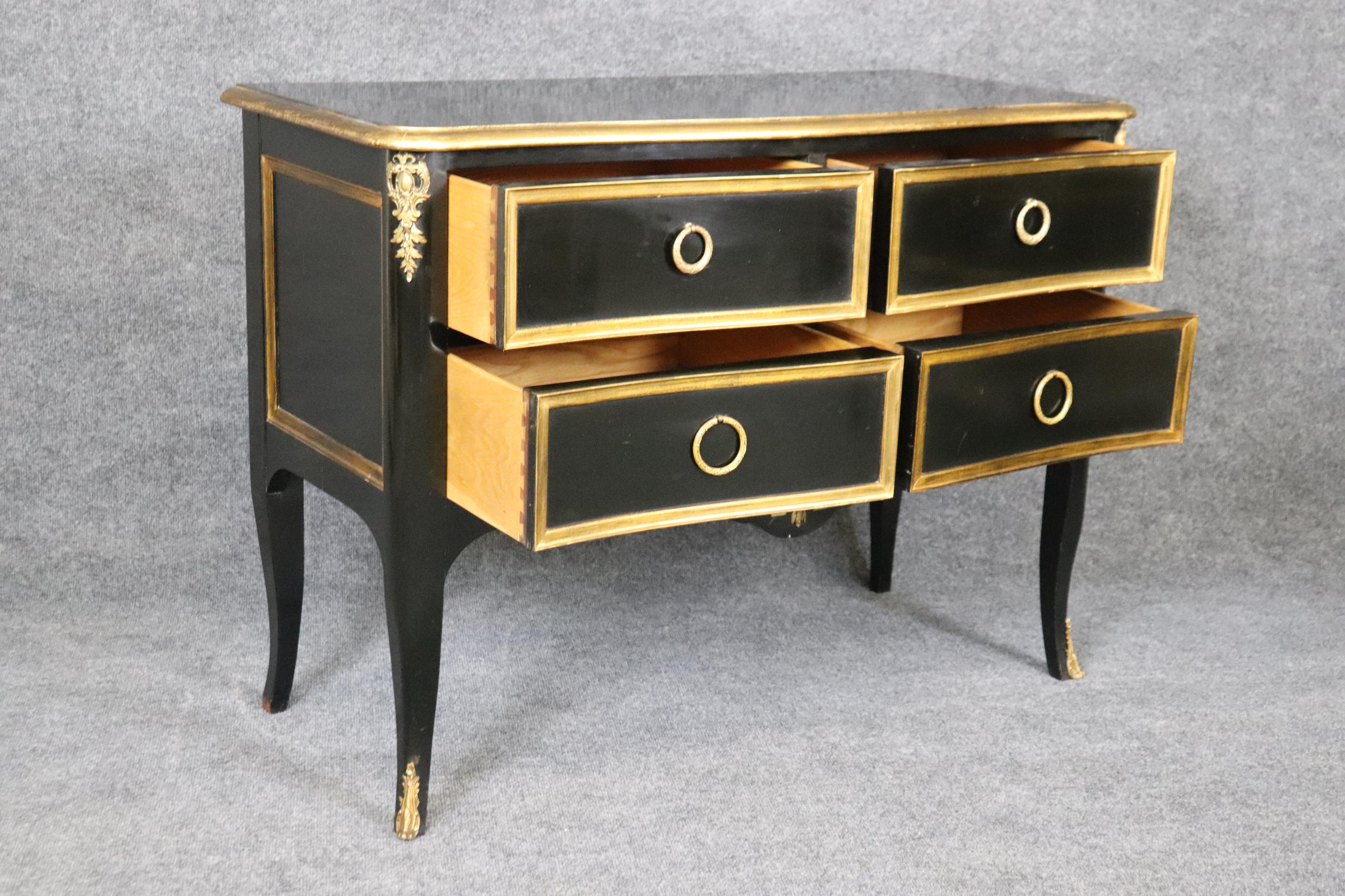 American Matched Pair of Maison Jansen style Ebonized and Gilded Louis XV Commodes For Sale