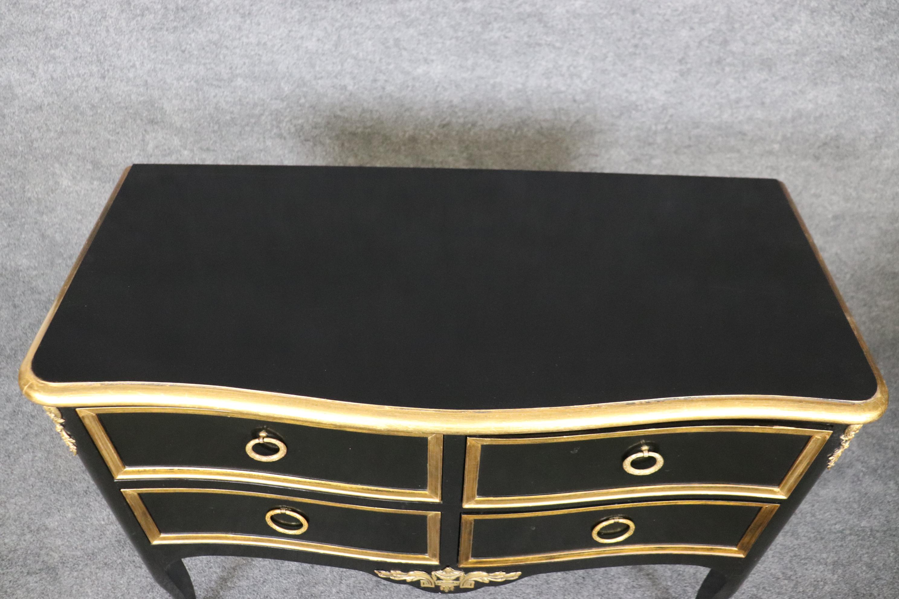 Mid-20th Century Matched Pair of Maison Jansen style Ebonized and Gilded Louis XV Commodes For Sale
