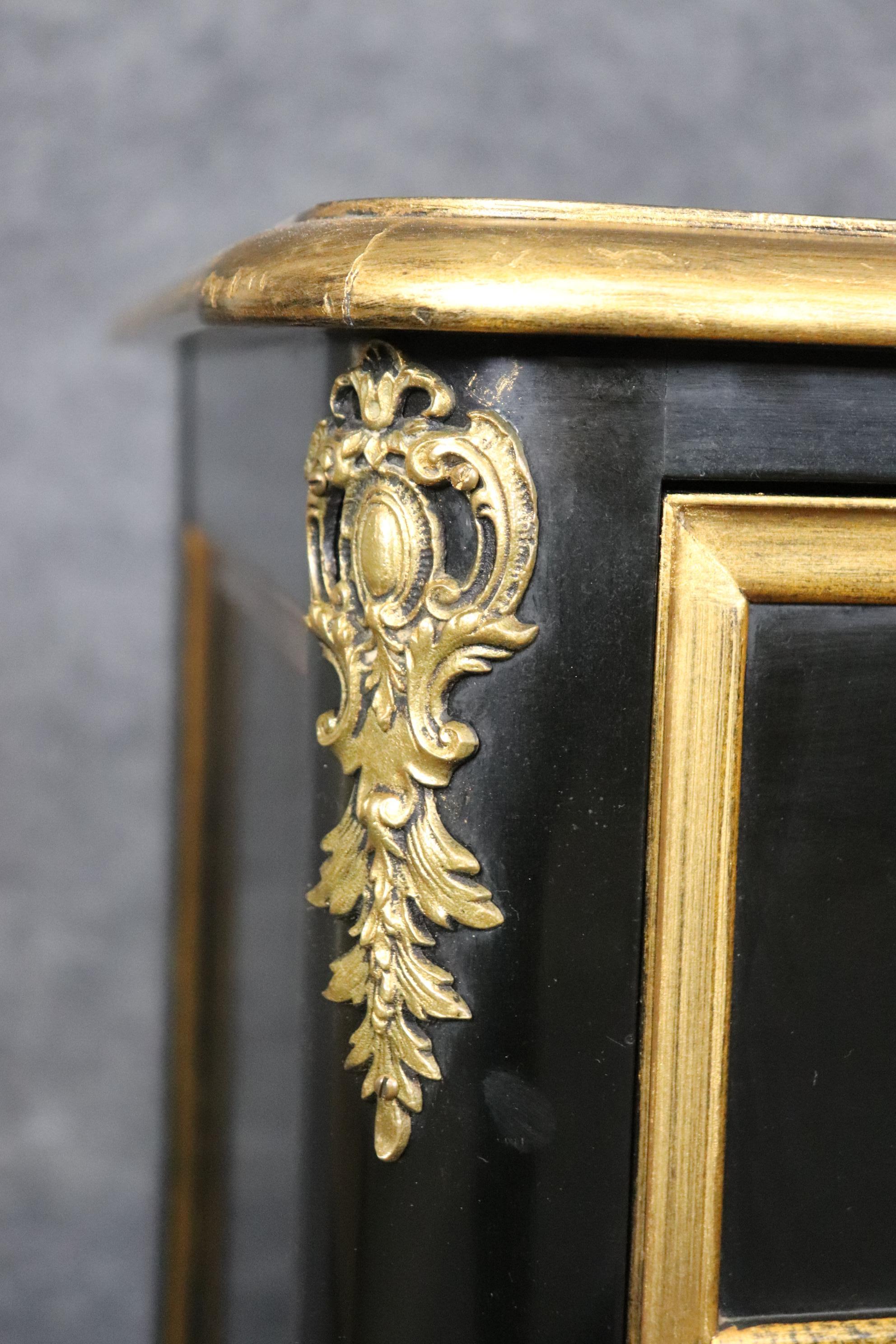 Matched Pair of Maison Jansen style Ebonized and Gilded Louis XV Commodes For Sale 1