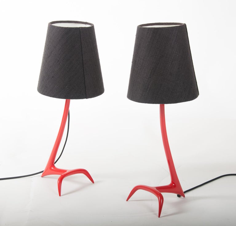 Matched pair of “pompier red” Stockholm table lamps by Maison Charles, designed by Jean Charles in the 1950’s – these versions are from the Charles Legacy series produced circa 2010 – One is solid bronze and is stamped “Charles” “Made in France”,