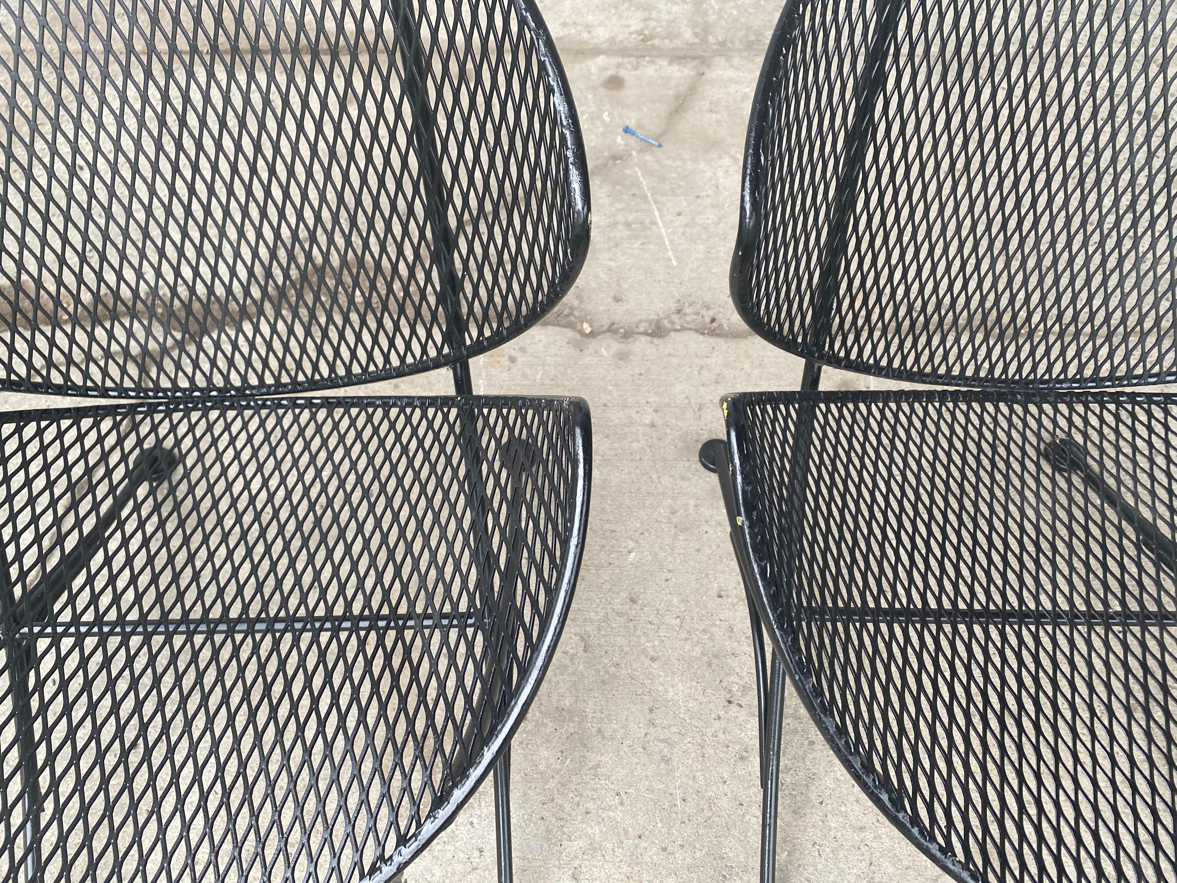 Fabulous and rare pair orange slice chairs. Freshly painted in a satin black enamel, chairs are in excellent vintage condition. Exceptional design by Maurizio Tempestini for John Salterini, Extremely comfortable, Hand delivery avail to New York City