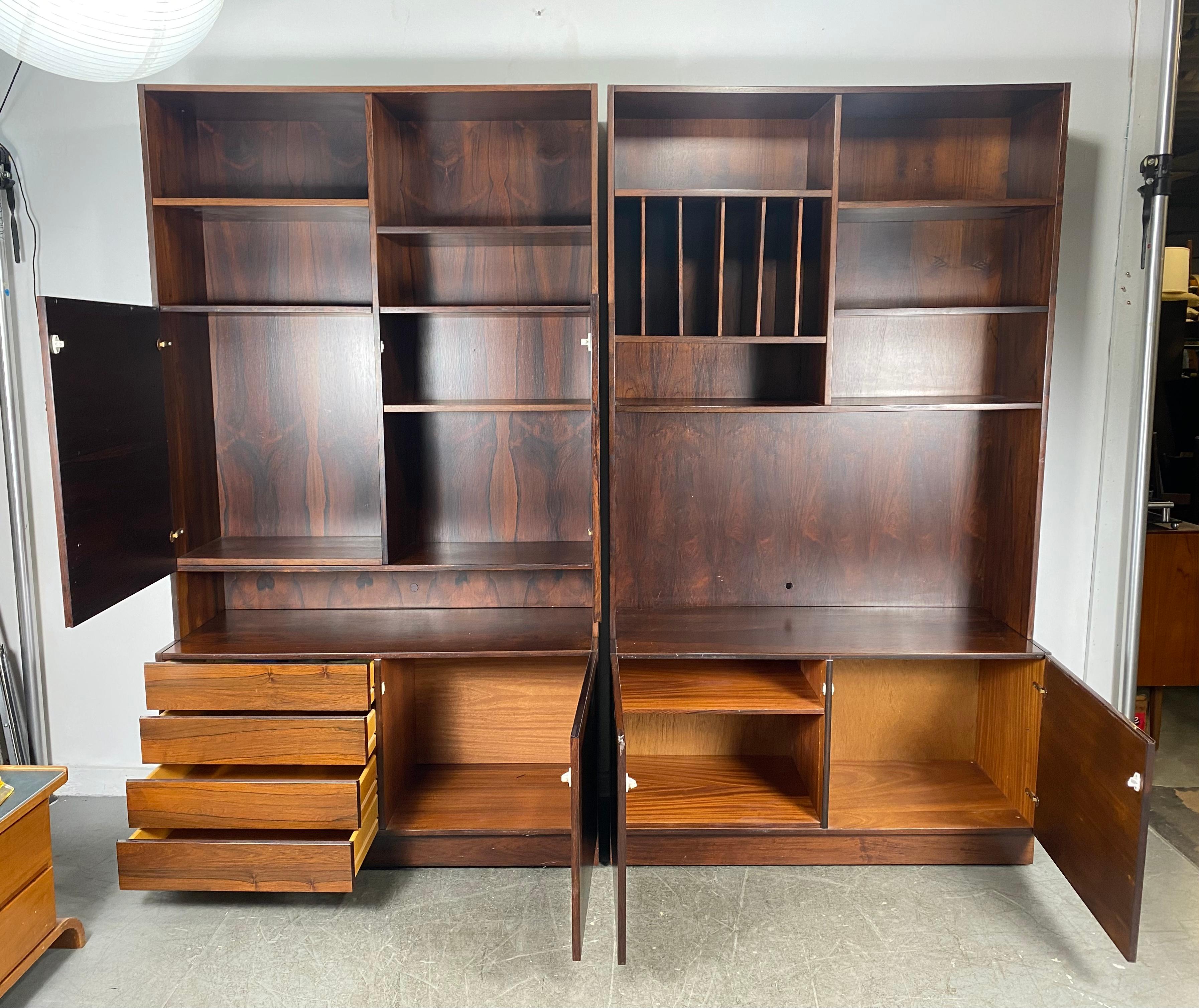 Matched pair Rosewood bookcase / cabinets made in Denmark P.B. Mobler.. Stunning wood graining.. Prefer to keep together but priced per cabinet,, Please specify what cabinet .configuration preferred ,Left cabinet adjustable shelves ,, drawers and