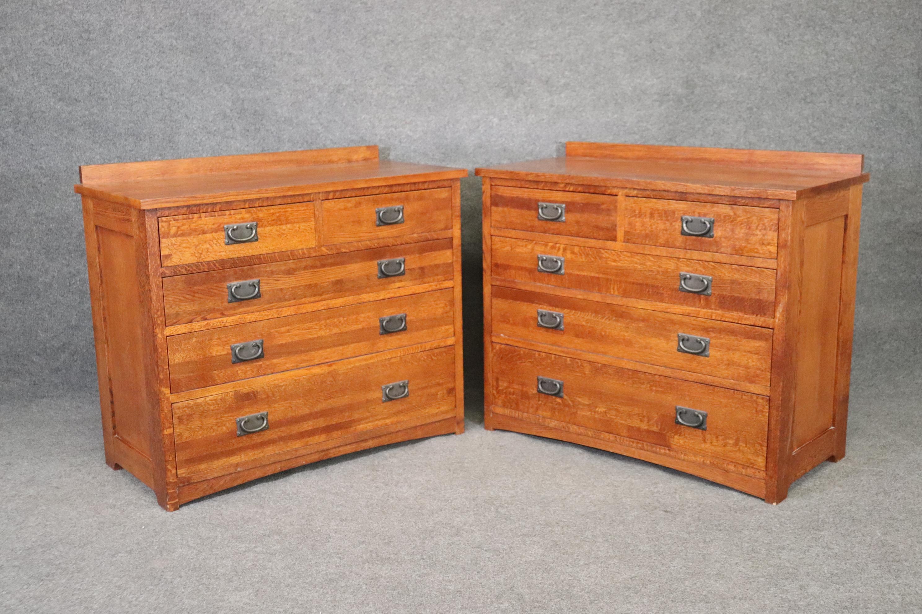 This is a beautiful pair of American-made dove-tailed solid quarter - sawn or tiger oak dressers. They are done in the classic mission style and in very good condition with minor signs of use as they are less than 20 years old. They have beautiful