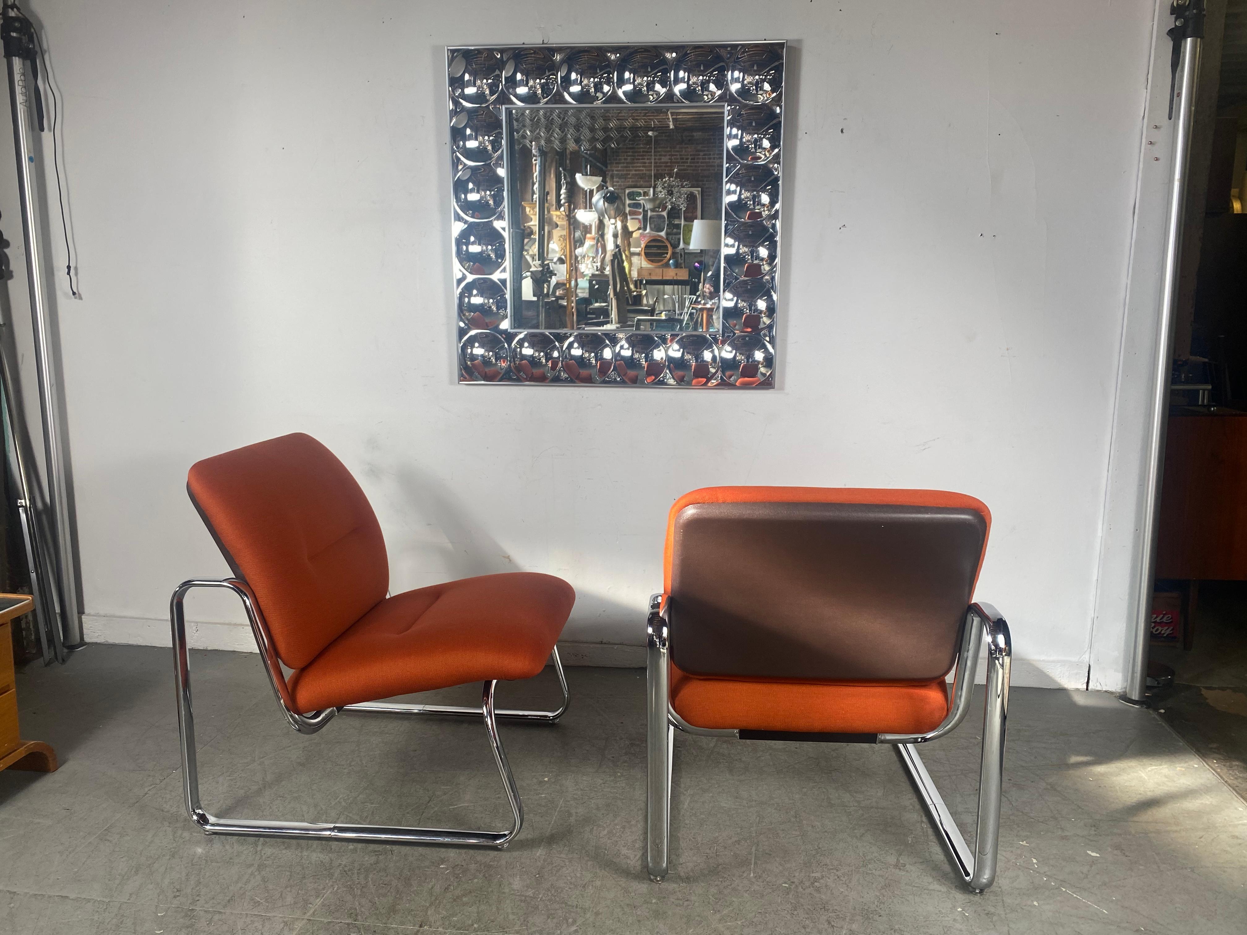 Unusual pair low slung slipper lounge chairs attributed to Peter Protzmann for Herman Miller.. Amazing original condition. Superior quality and construction. Retains its original Knoll Contract Fabric. Extremely comfortable. Classic 1970s Space age