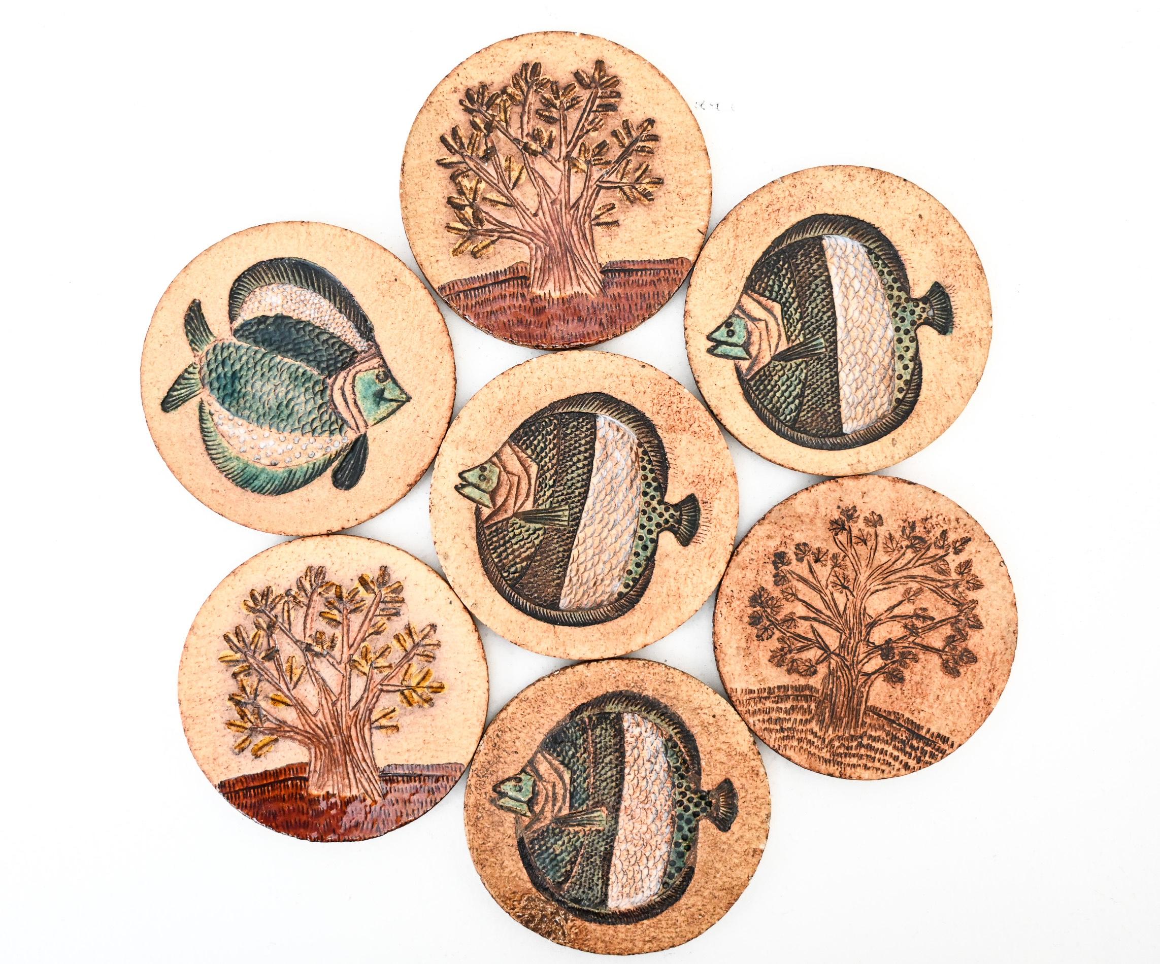 A matched set of earthenware drinks coasters by Roger Capron
with incised and coloured decoration depicting trees and fishes.

Stamped signatures to the reverse

Vallauris, France, circa 1970

(priced for the set)

Measures: 11.5cm diameter