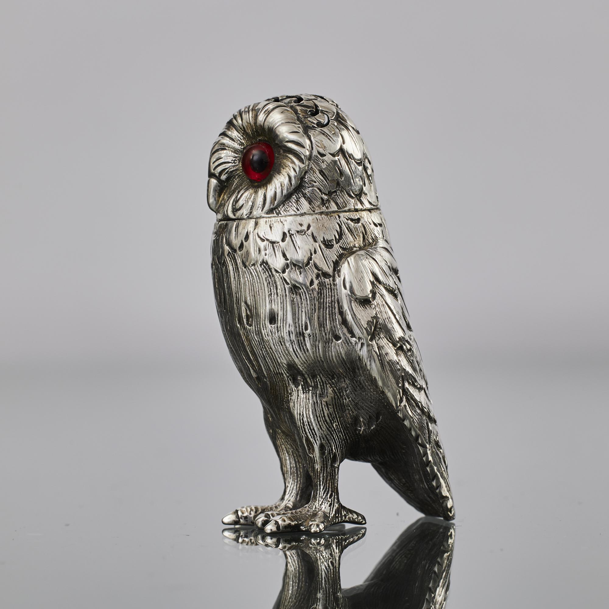 Antique Victorian era silver pepper castor in the form of an owl. The piece has glass eyes inset and has a hand-pierced head.
 
 Known as the king of spices, pepper is one of the oldest and most popular spices in the world as well as the most widely