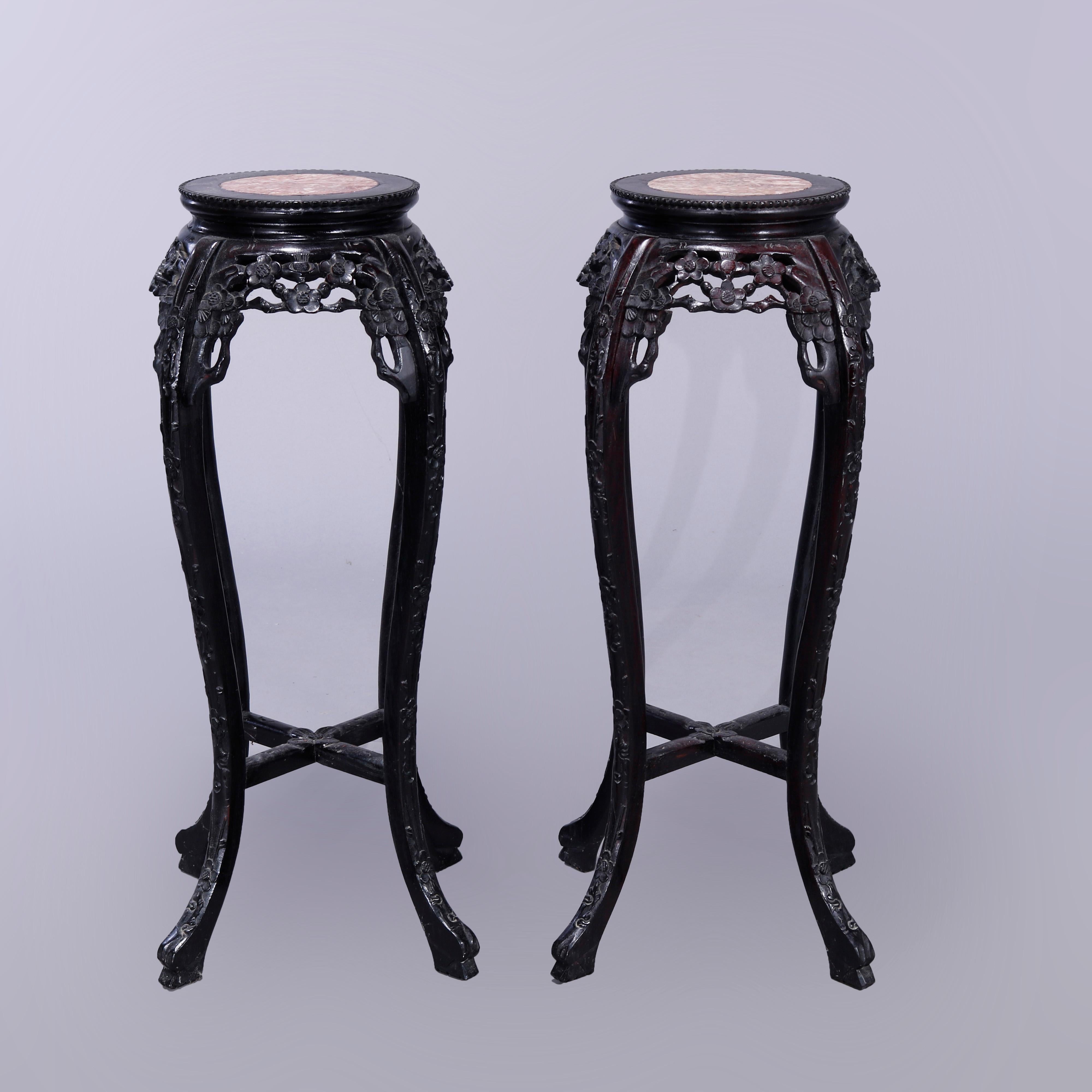 A matching pair of Chinese plant stands offer inset marble top with carved hardwood frames having bead border, pierced floral and foliate skirt, raised on cabriole legs having cross stretcher at base, 20th century

Measures - 35.75'' H x 20'' W x