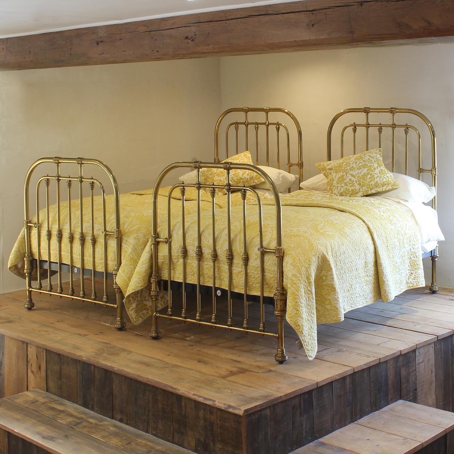 A stunning matching pair of all brass bedsteads originally made for the famous department store of Edinburgh, Charles Jenner. With a charming hoop design this pair of beds has an elegant feel and would grace and bedroom. The beds have their original