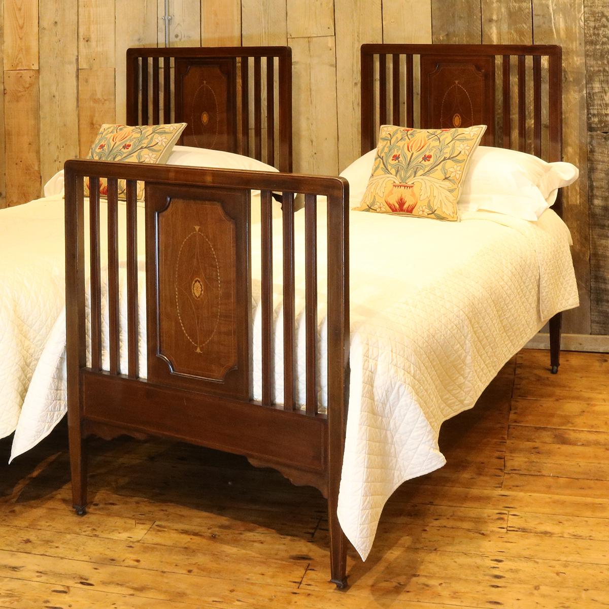 Matching pair of mahogany Edwardian beds with inlaid panels.

These beds accept 3ft wide (36 inches) bases and mattresses. They can be any length required (75 inches, 78 inches or more) and can Stand together to form an extra wide bed if