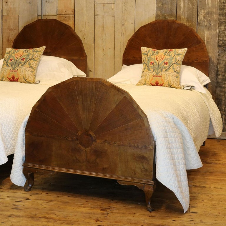 Matching pair of mahogany Edwardian beds with inlaid panels and unusual shaped headboards and footboards.

These beds accept 3ft wide (36 inches) bases and mattresses. They can be any length required (75 inches, 78 inches or more) and can Stand