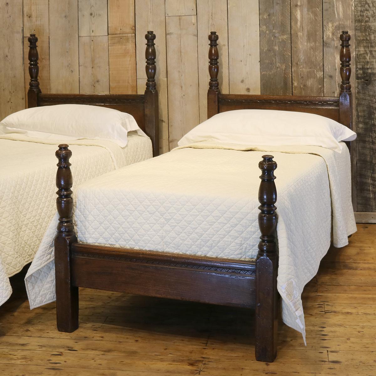 Matching pair of oak beds with plain panels and tall spindle posts.

These beds accept 3ft wide (36 inches) bases and mattresses. They can be any length required (75 inches, 78 inches or more) and can stand together to form an extra wide bed if