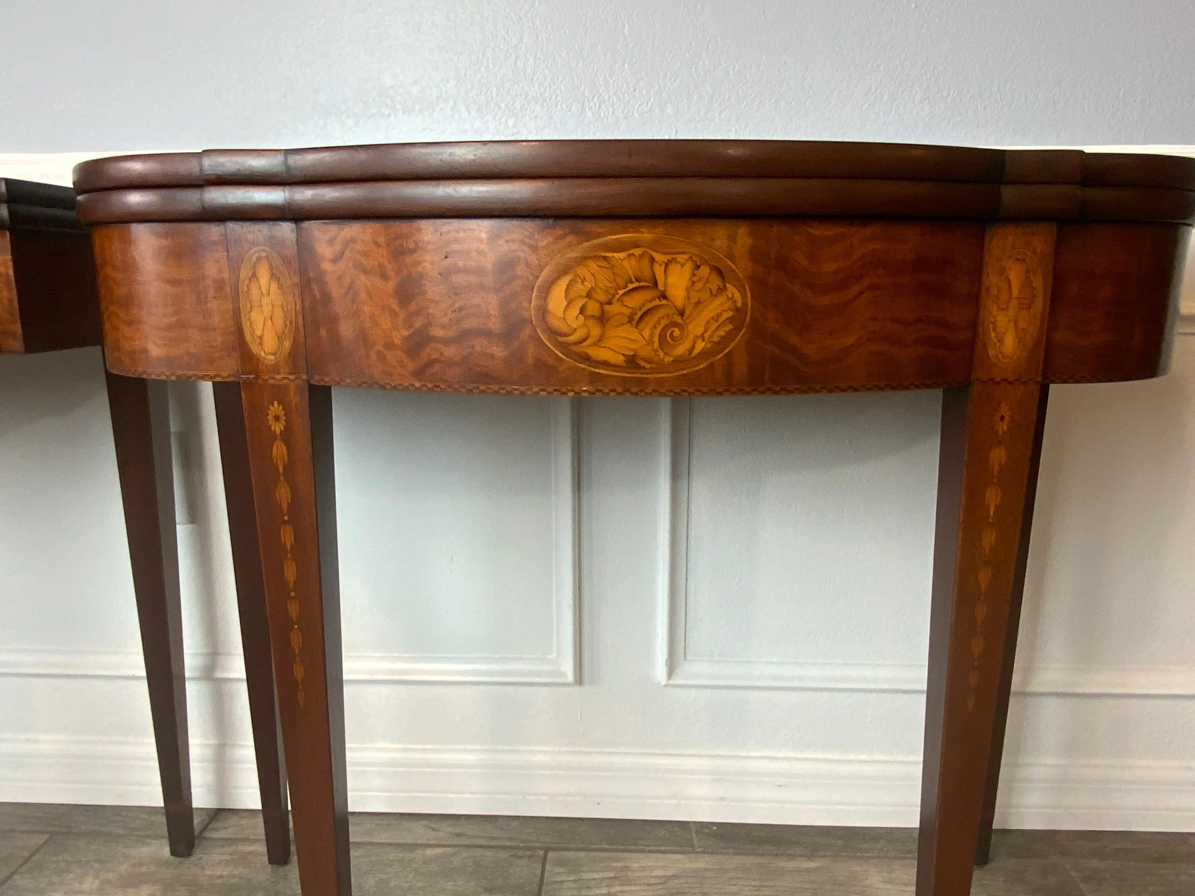 A very nice matching pair of Mahogany inlay Hepplewhite style card tables signed by Benjamin Ferber. Very good original condition with minor surface imperfections mainly on the insides of the tops. Superb color and craftsmanship with a center shell